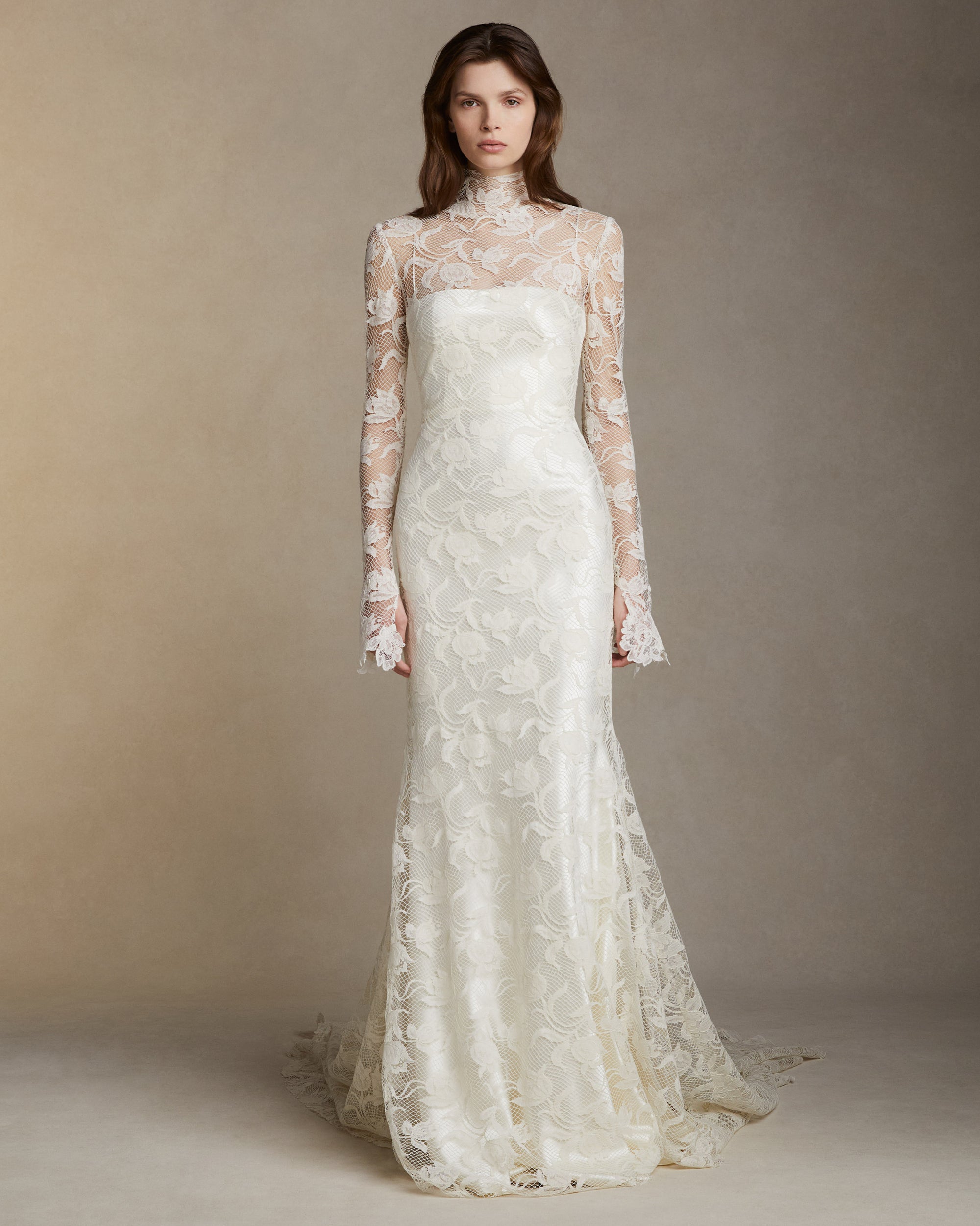Silk wool long sleeve high neck gown with tulip lace overlay and hand cut Lyon lace appliques. Invisible zip closure at center back.