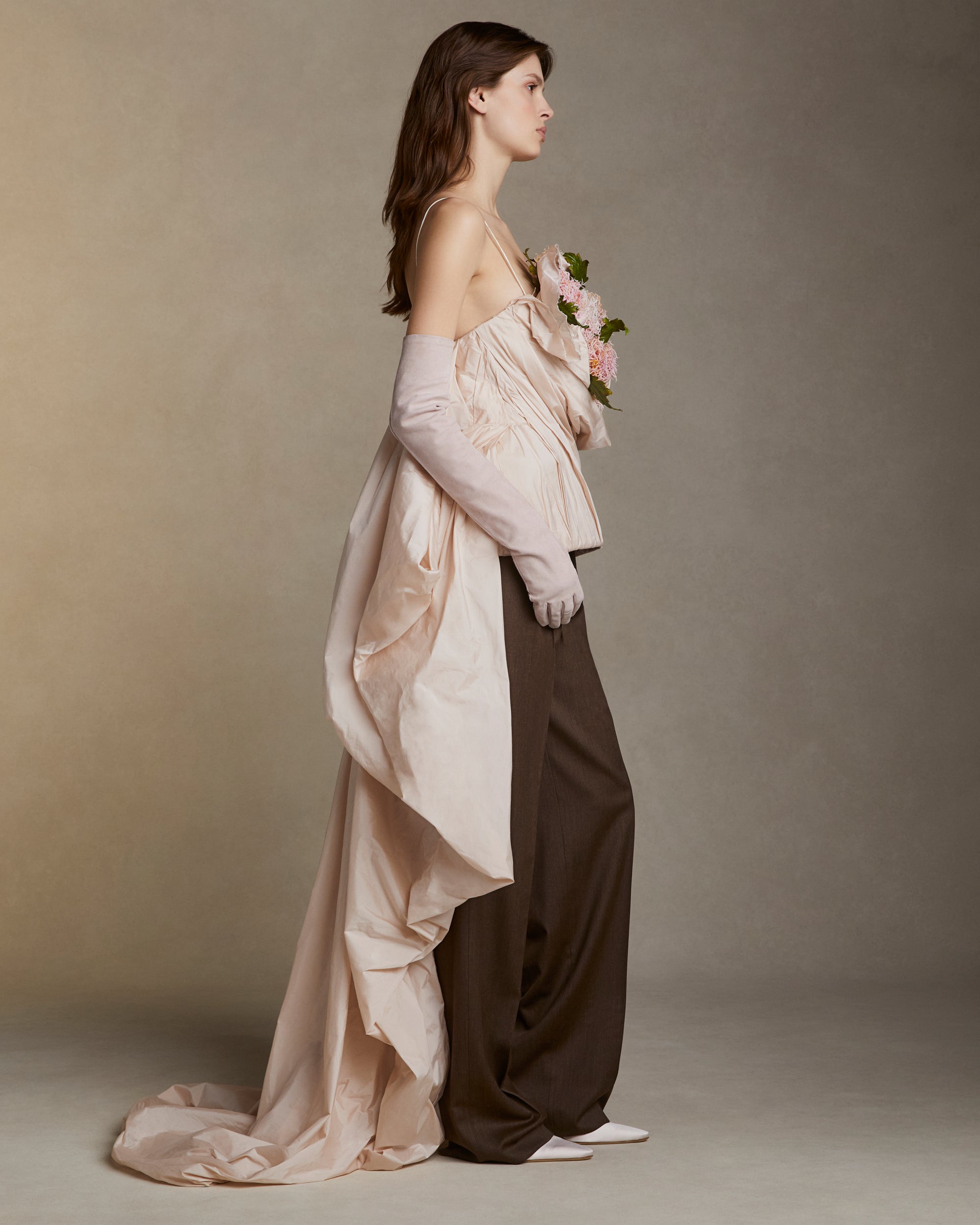 Featherweight silk taffeta bustier with hand crafted clay chrysanthemums and leaves. Layers of taffeta weave in and out of the clay flower bouquet, falling into a watteau at back. 