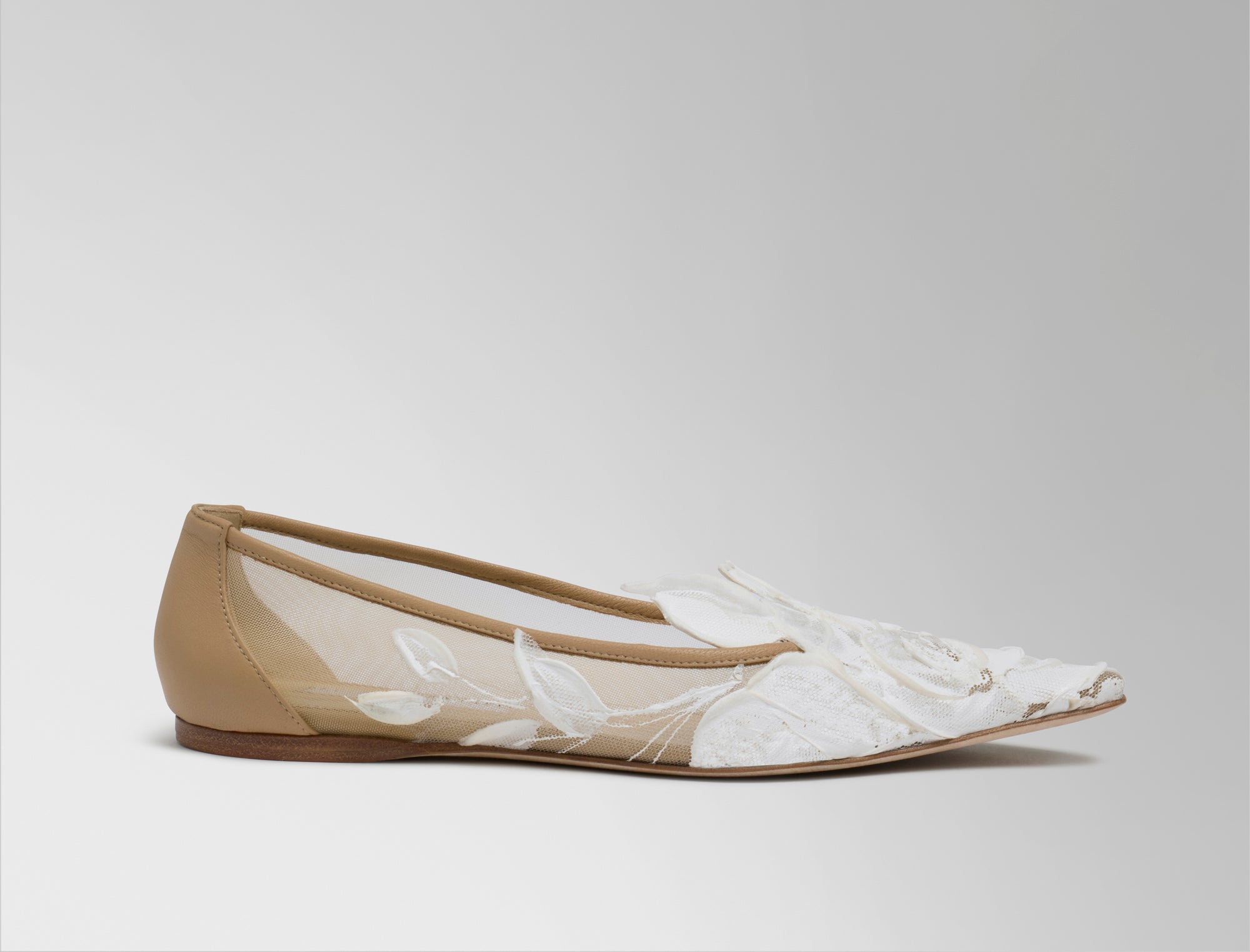 Mesh ballerina flat crafted in Italy with hand painted ivory floral detail. Elongated round toe, tonal piped leather top edge, and covered heel.