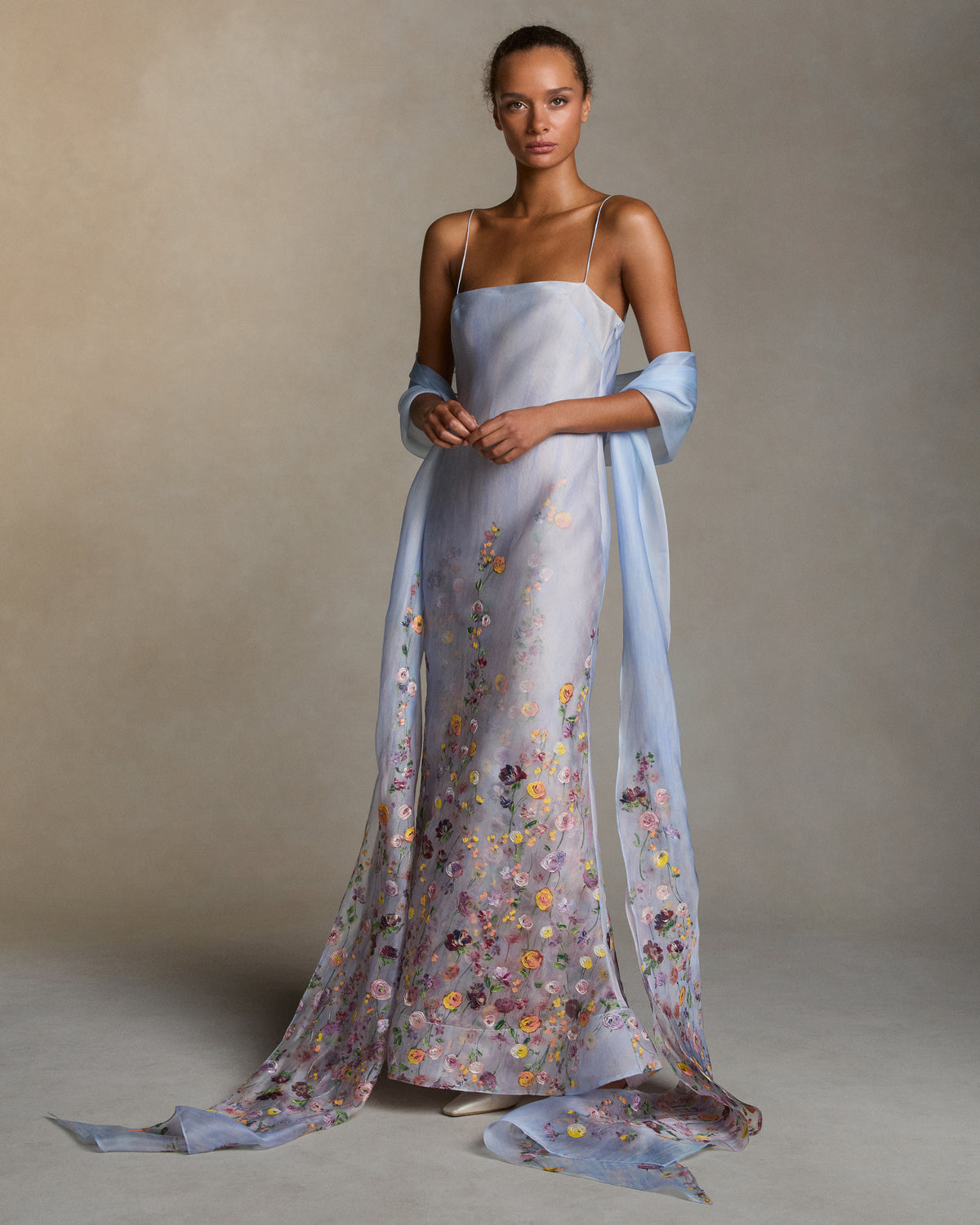 Silk Organza stole with a printed watercolor effect and hand-painted florals climb and fade softly up the body. 18