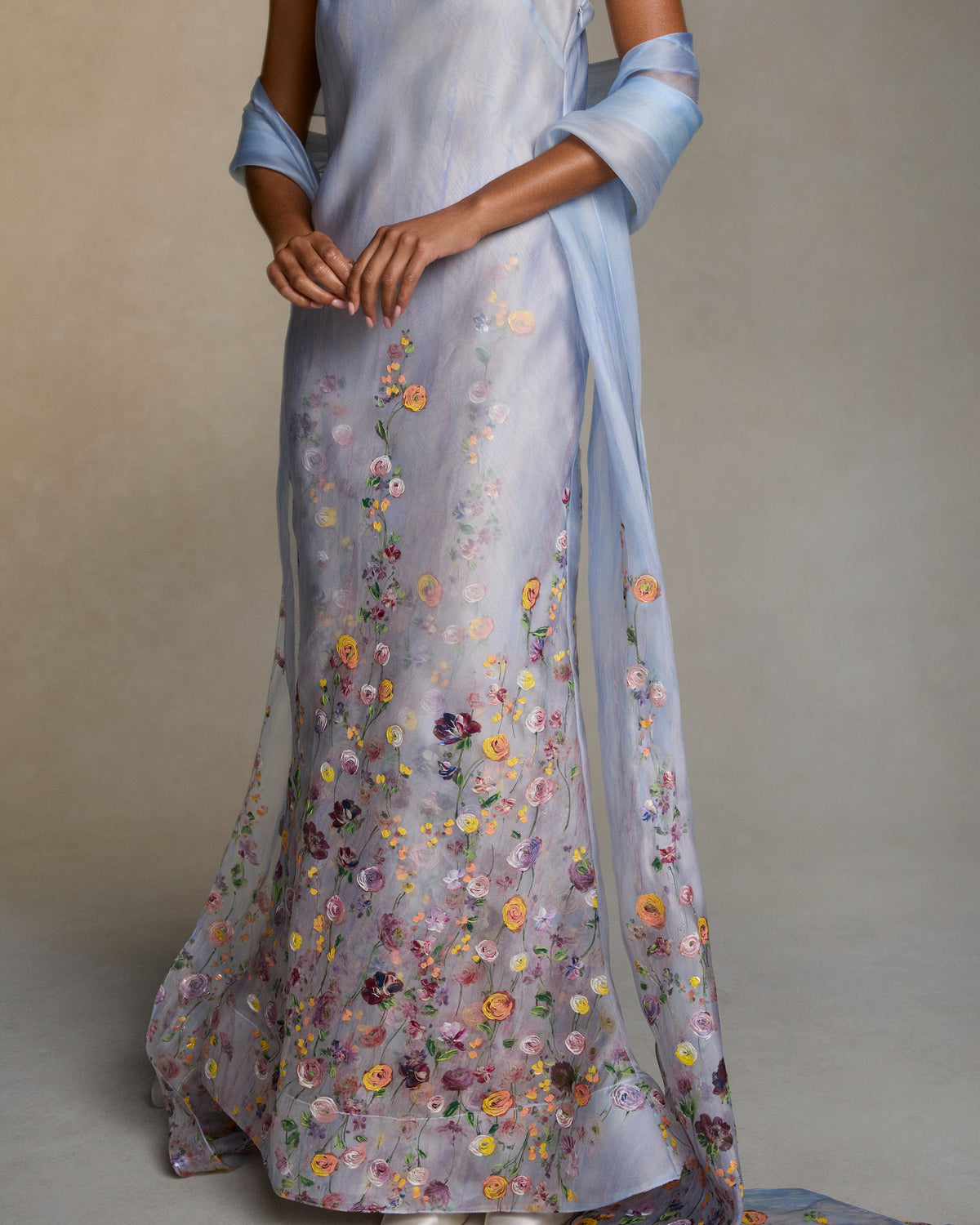 Silk Organza stole with a printed watercolor effect and hand-painted florals climb and fade softly up the body. 18