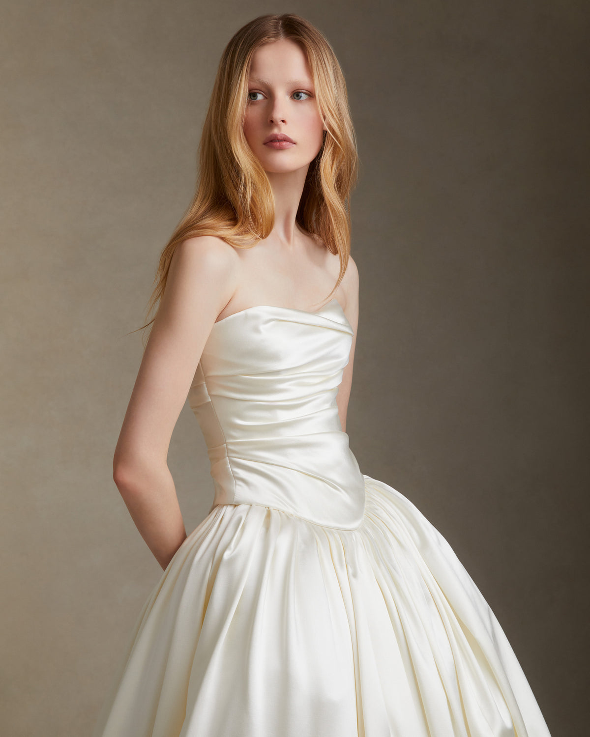 Dramatic silk wool ball skirt with basque waist yoke and bubble hem detail. Invisible zip closure at center back.Styled with Demi bustier