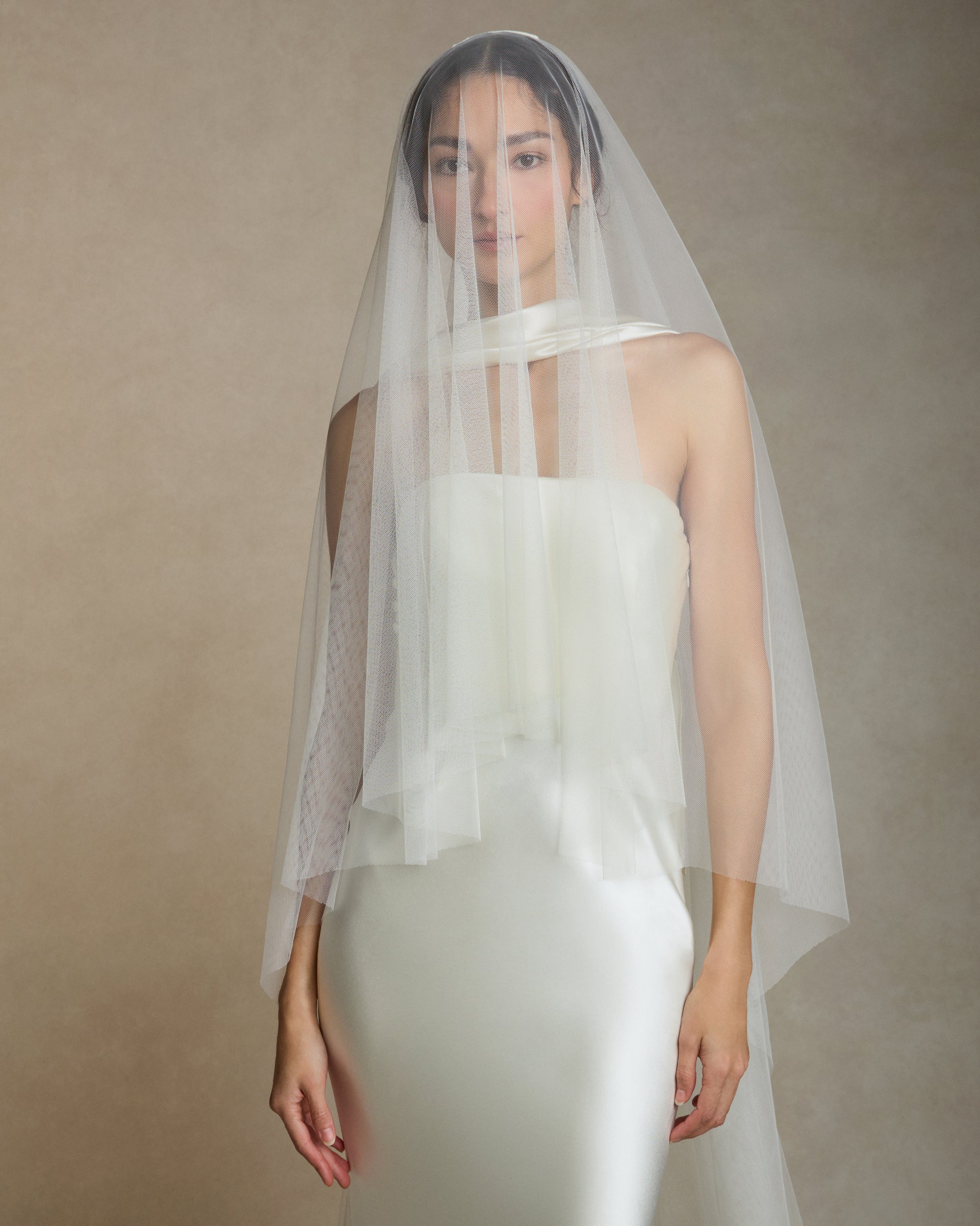 Soft tulle veil with blusher. Veil is 135" total length, 107" from comb to end of train, 28" from comb to end of blusher