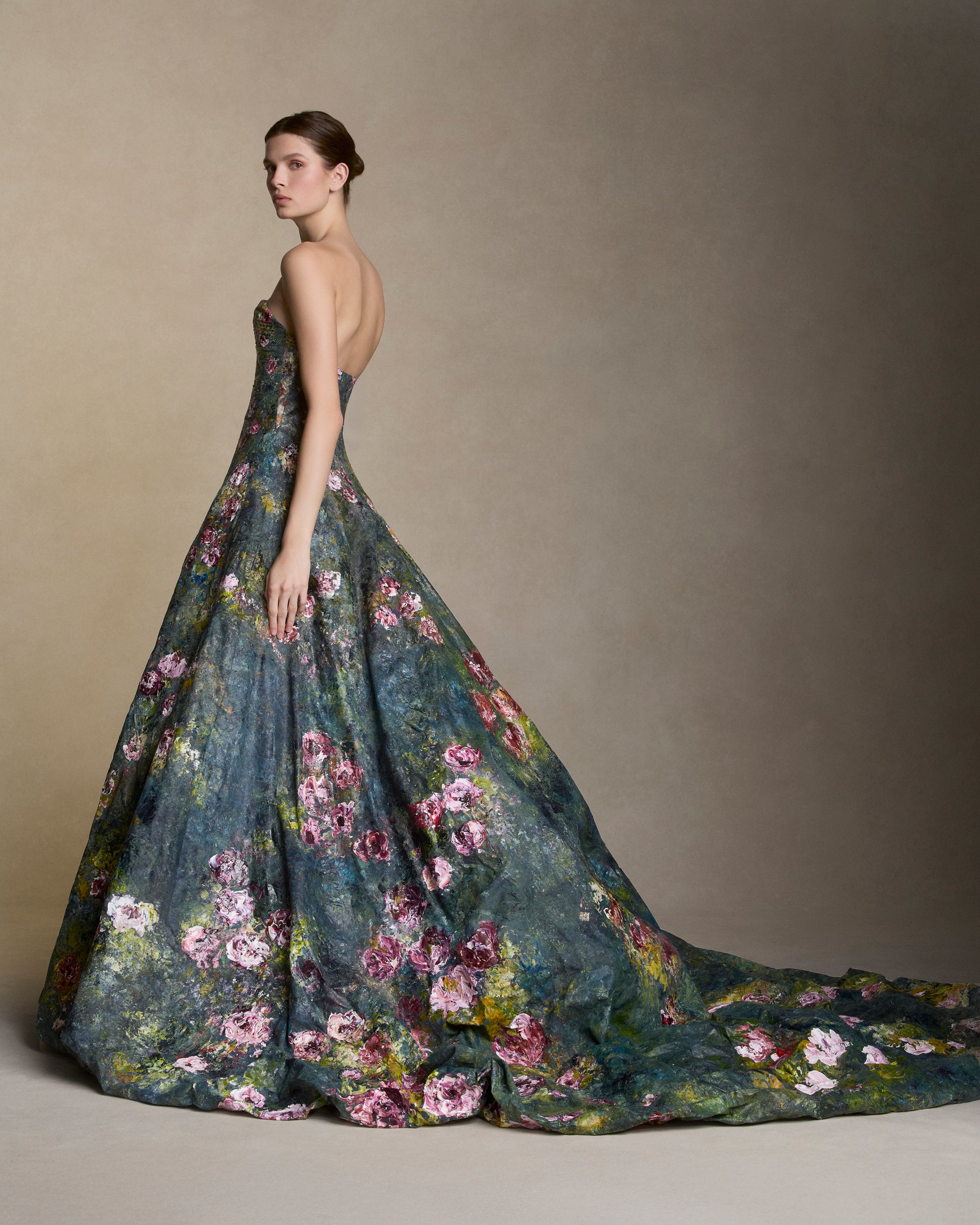Floral hand painted silk organza strapless ballgown with soft sweetheart neckline. Boned internal bustier, internal grosgrain belt and invisible zip closure at center back.