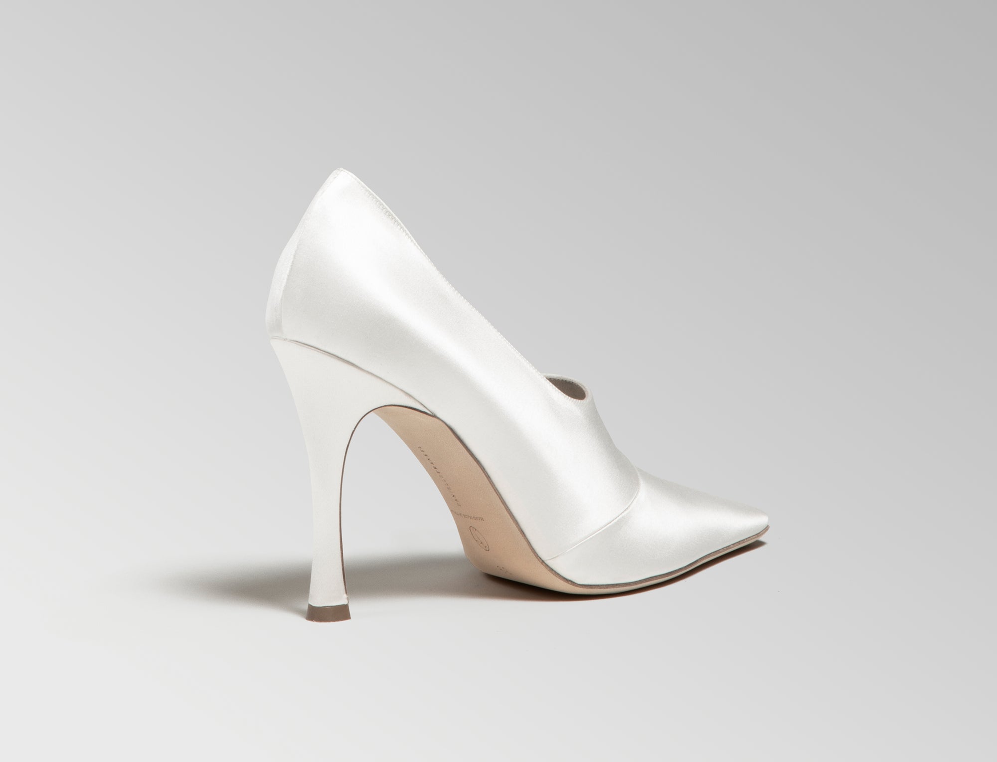 Ivory satin square toe high vamp pump with shaped seam detail.  100mm heel. Hand crafted in Italy. 
