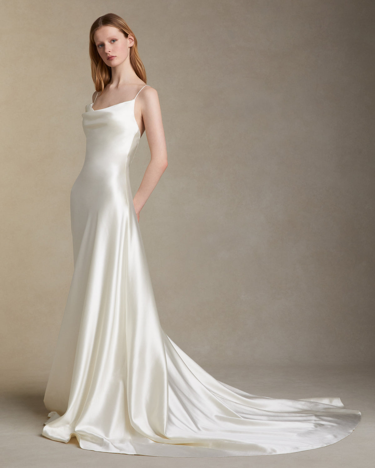 Silk wool A line bias gown with asymmetric dipped neckline. Internal bustier. Invisible zip closure at center back.