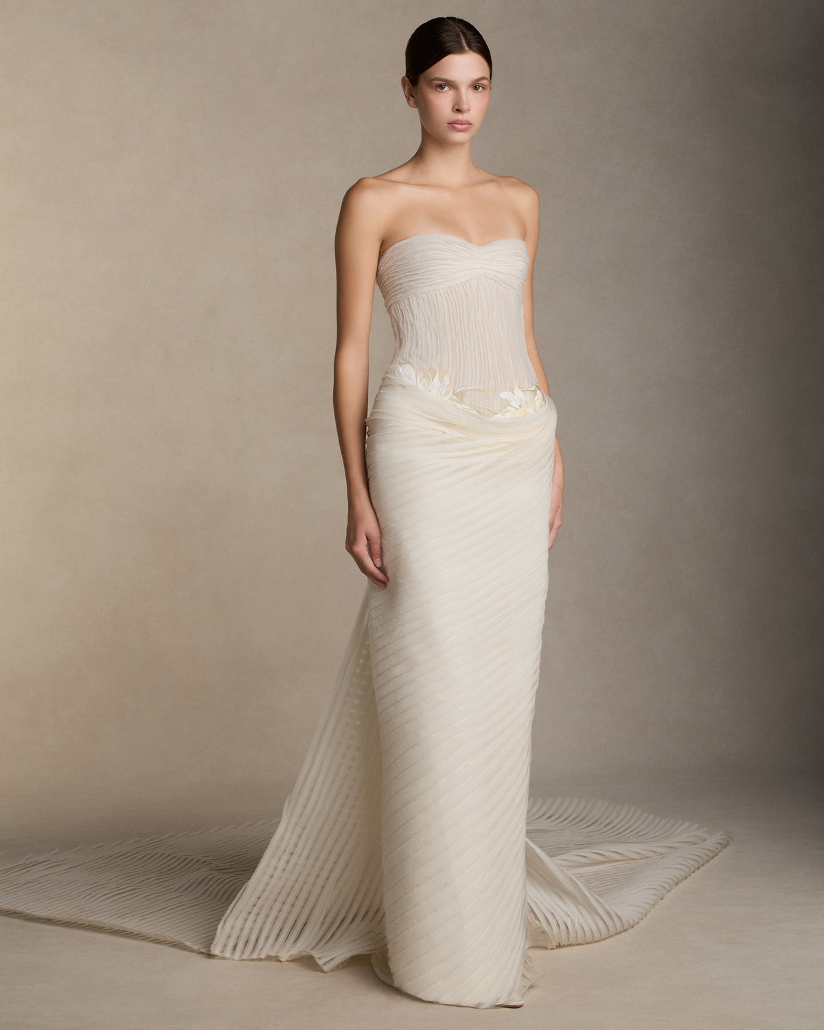 Crinkle organza and chiffon bias strip gown with hand painted iris florals at waist. Ivory crinkle organza organza bias strip embroidery decorates the nude bobinette bodice and transparent chiffon bias strip horsehair embroidery cascades over a silk wool twill column skirt. Invisible zip closure at center back.