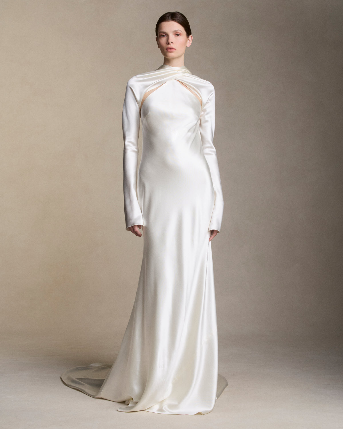Removable tulle sleeves drape across center front falling into a scarf train detail at center back.  