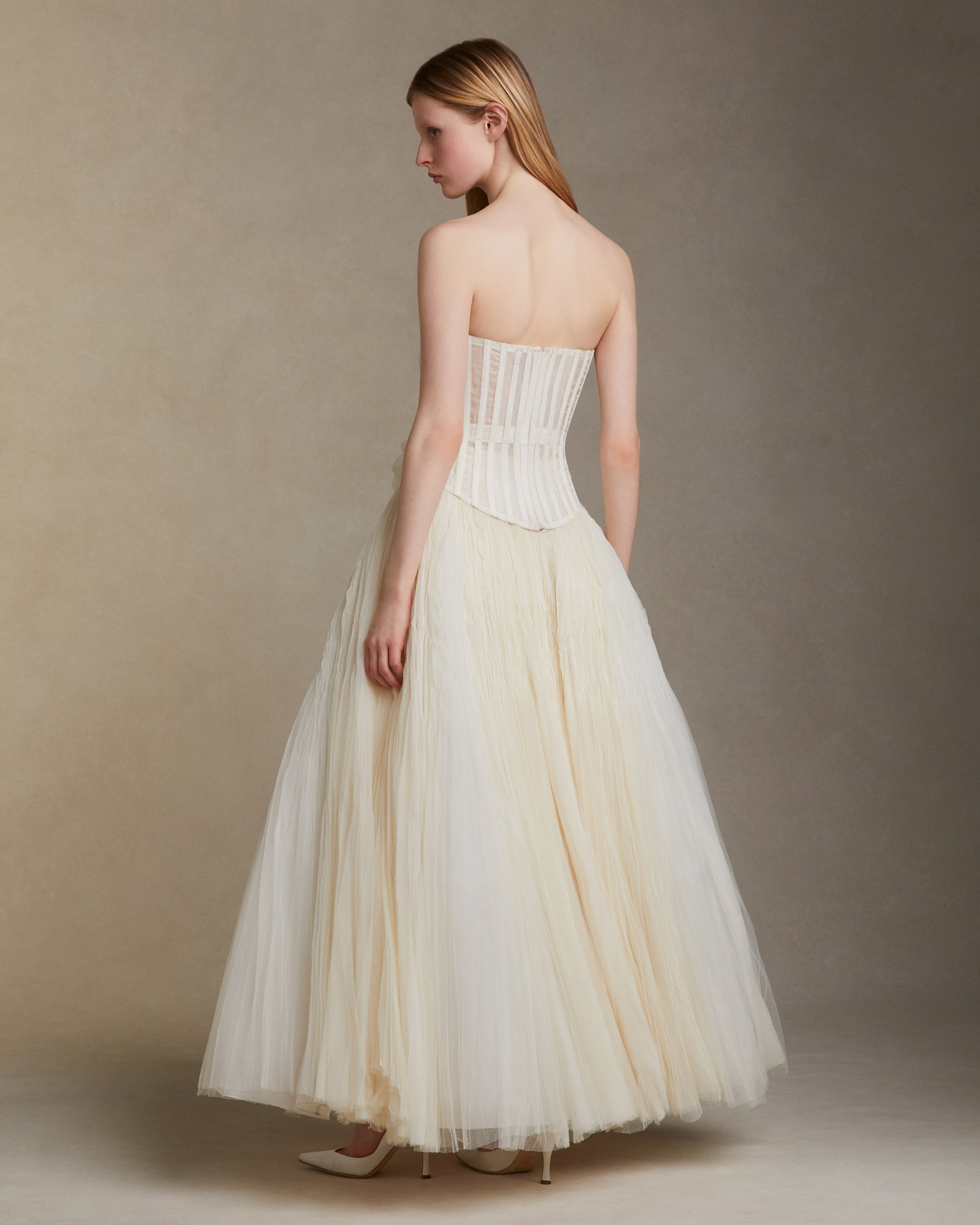 Sunburst pleated hand crinkled soft tulle ball skirt with cotton twill basque waist yoke. Center back zip closure.Styled with Georgia Bustier &amp; Baroque Pearl StudsStyled with Milo Bustier