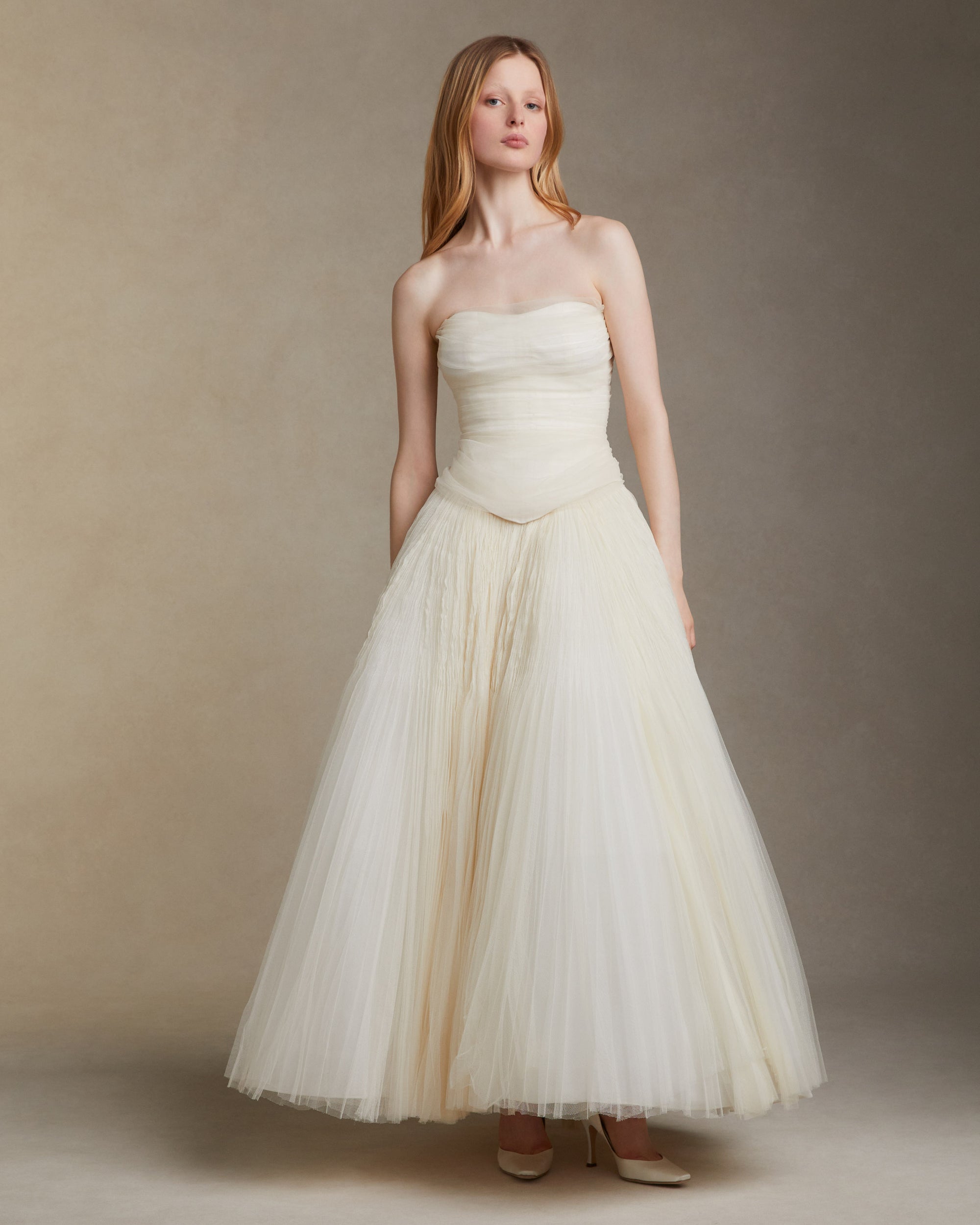 Sunburst pleated hand crinkled soft tulle ball skirt with cotton twill basque waist yoke. Center back zip closure.Styled with Georgia Bustier &amp; Baroque Pearl StudsStyled with Milo Bustier
