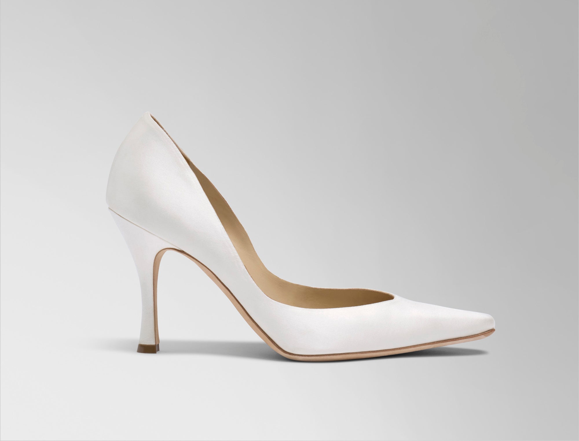  Sleek rounded square toe classic pump crafted in Italy of ivory satin. 90mm heel. 
