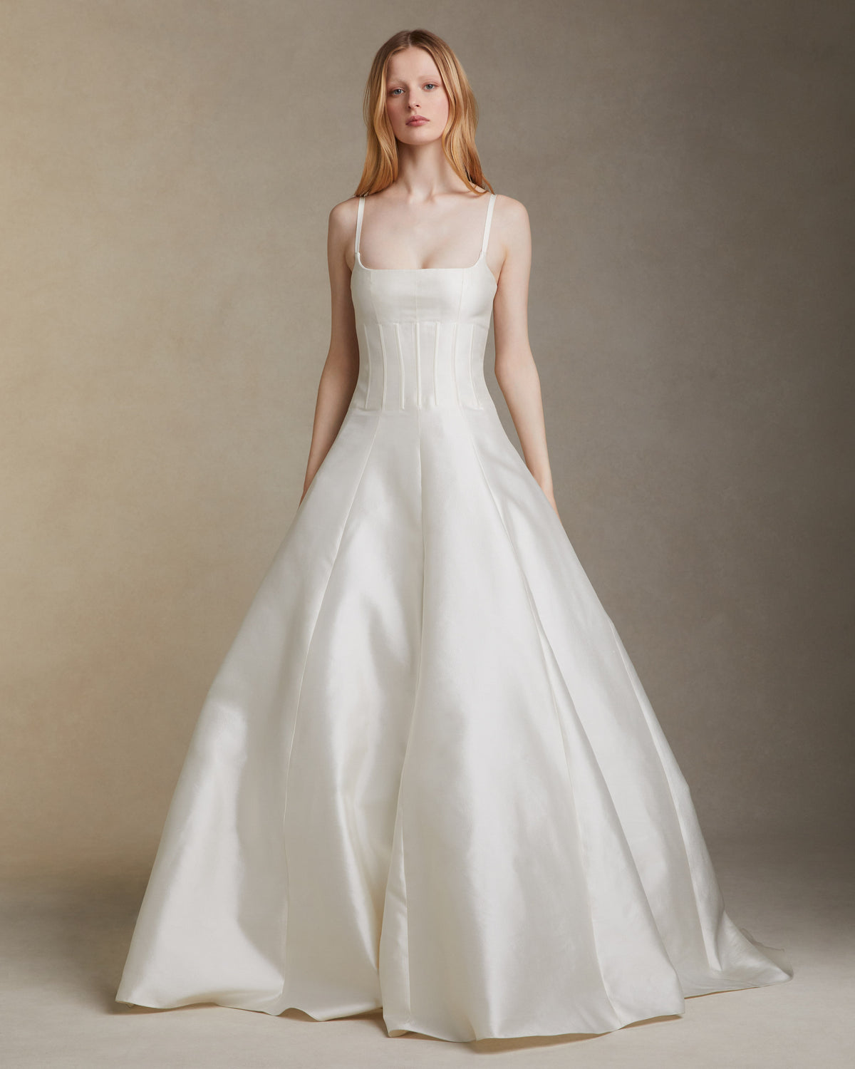Silk wool twill square neckline gown with external boning at the bodice and grosgrain straps. Invisible zip closure at center back.