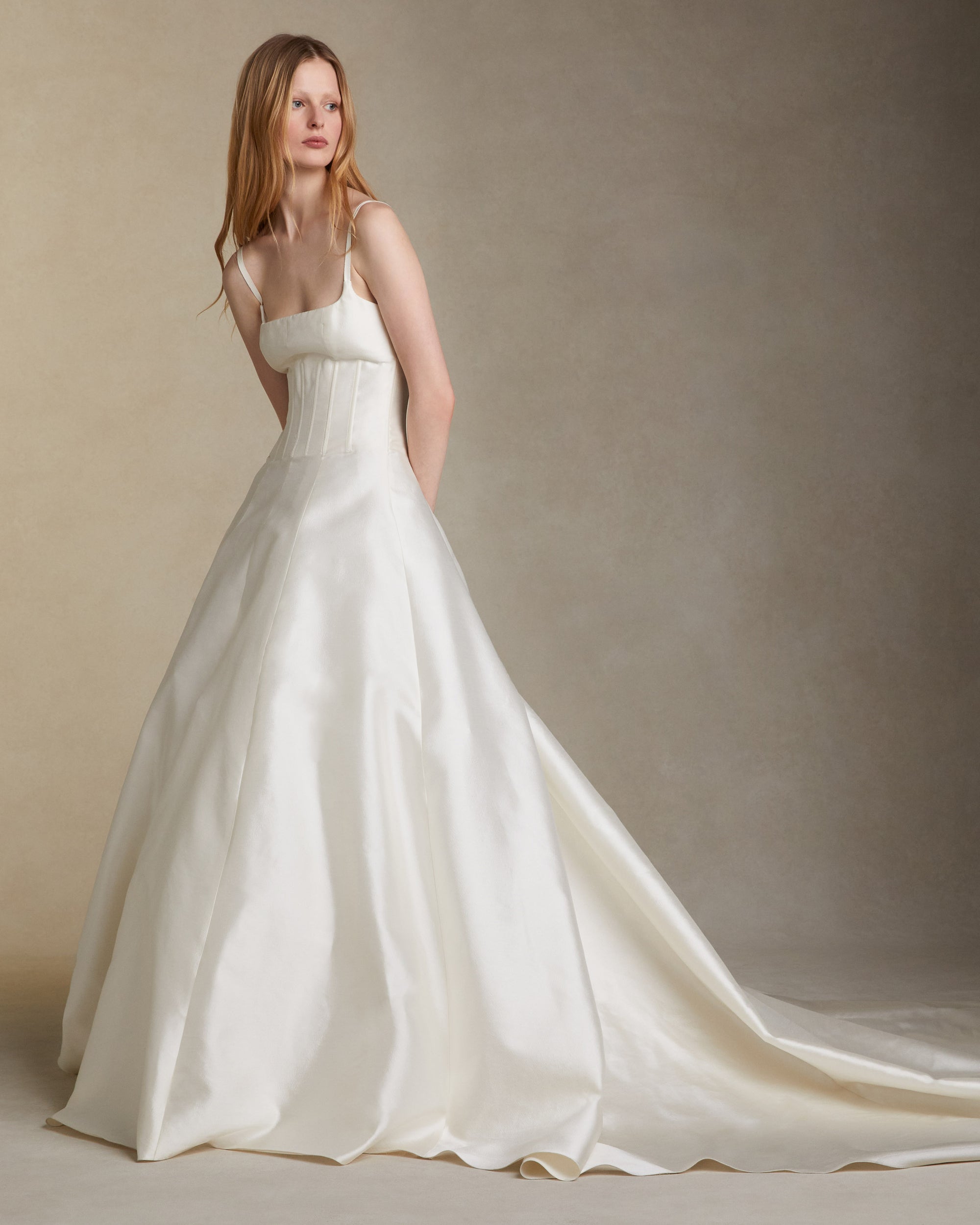 Silk wool twill square neckline gown with external boning at the bodice and grosgrain straps. Invisible zip closure at center back.