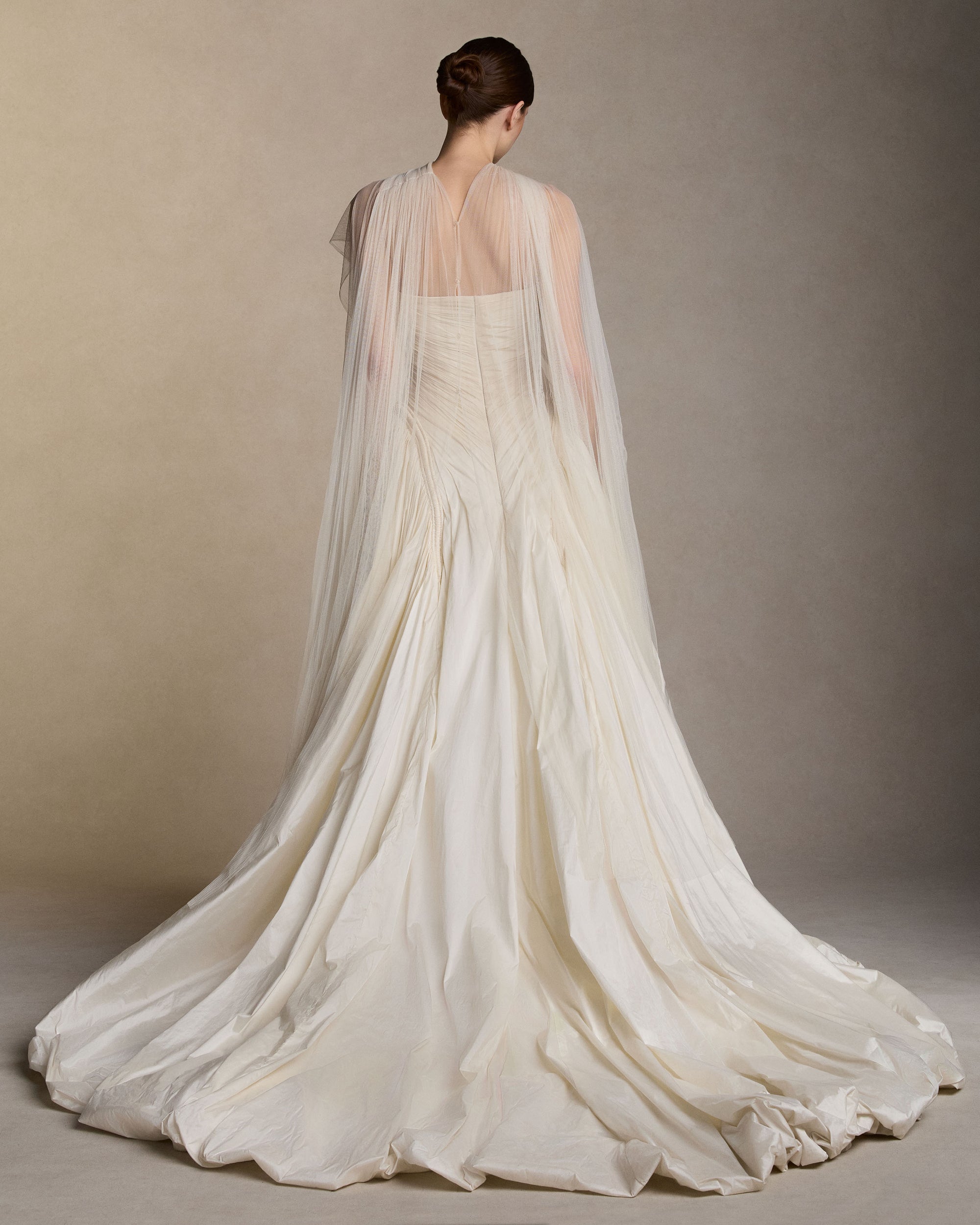 Soft tulle draped scarf with release pleat detail and button closure at center back - 100" total length