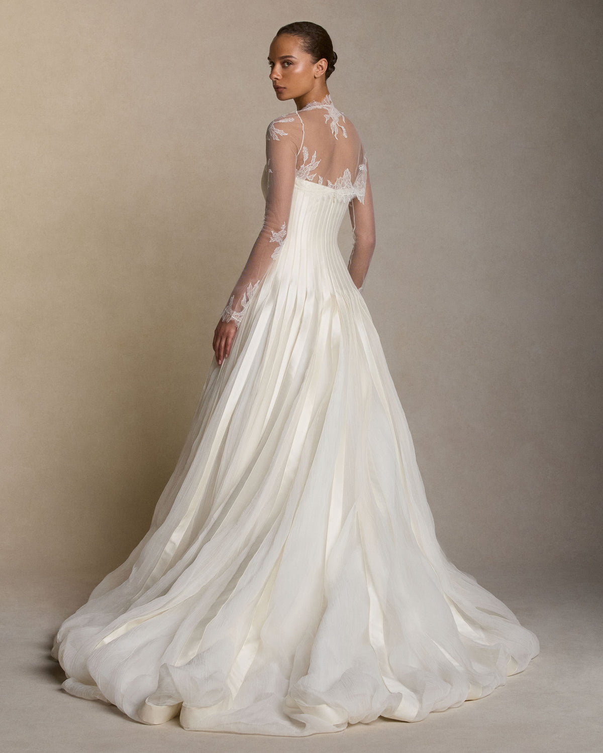 Tulle long sleeve bolero with hand cut chantilly lace appliques and scalloped border detail.Styled with Audrey gown