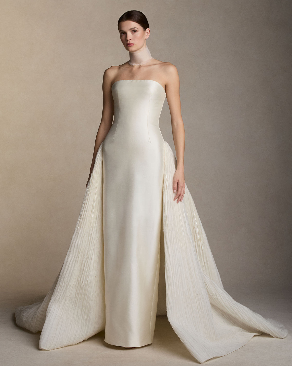 Silk organza collar with hand frayed border detail. Covered button and elastic loop closure. 