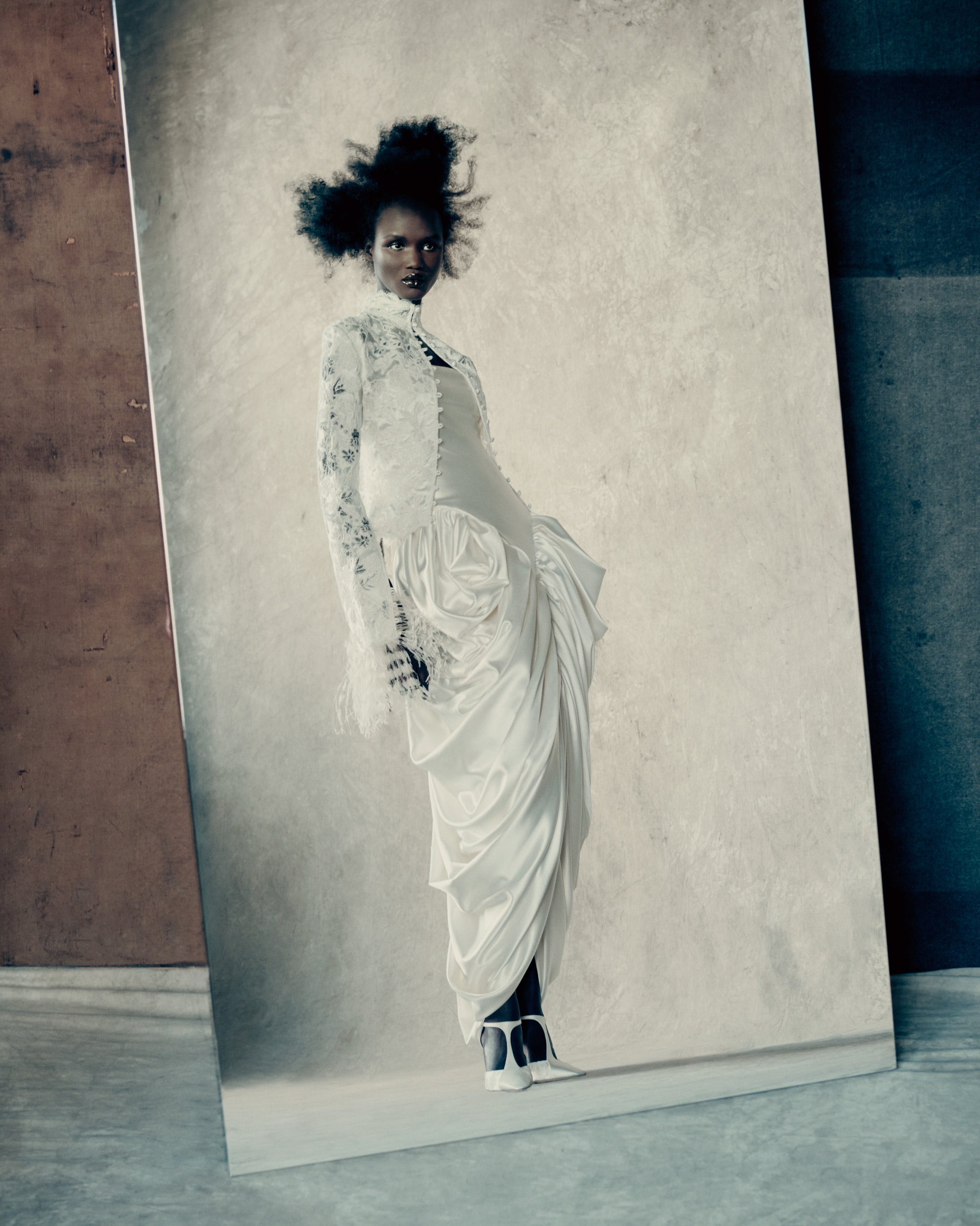 Silk wool and corded lace jacket with scalloped edge detail and covered button closure. Lustrous silk and wool is layered with corded lace, re-embroidered and delicately cut away to create dimensional layers of transparency and shine. Styled with Nadia dress