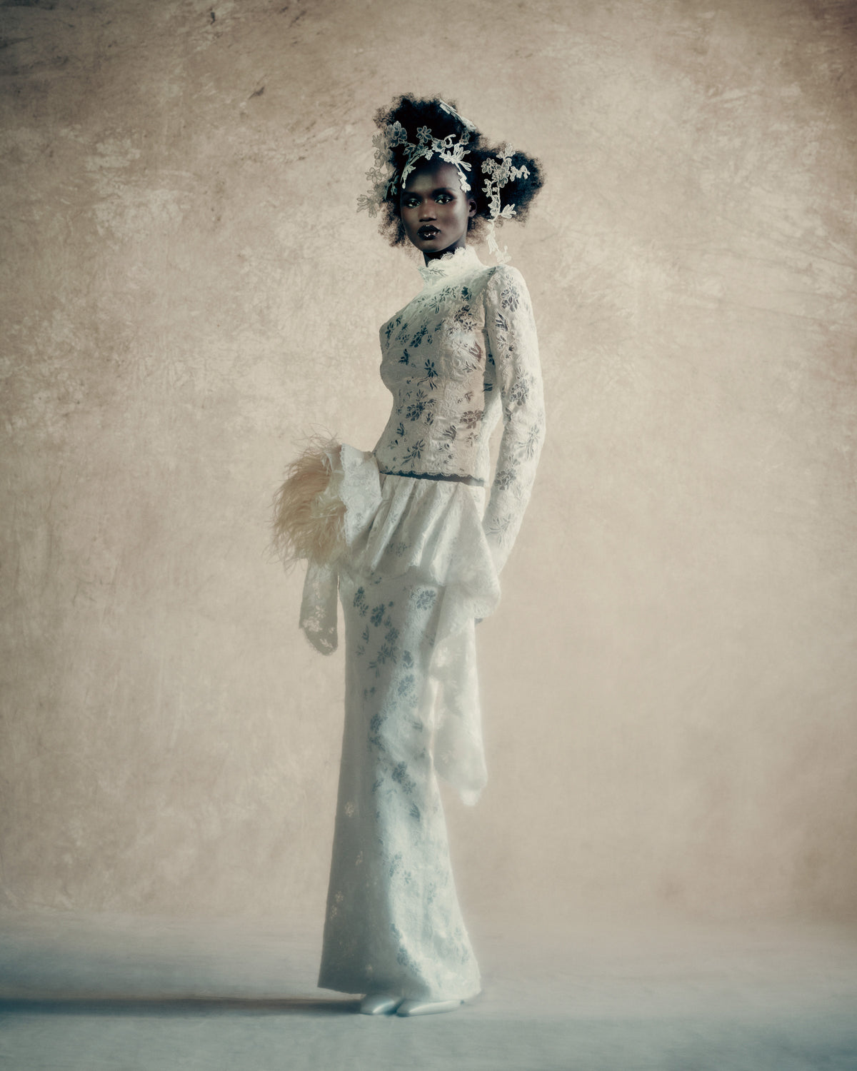 Silk wool and corded lace top with scalloped edge detail and covered button closure at center back. Lustrous silk wool is layered with corded lace, re-embroidered and delicately cut away to create dimensional layers of transparency and shine. Styled with Whilemena skirt