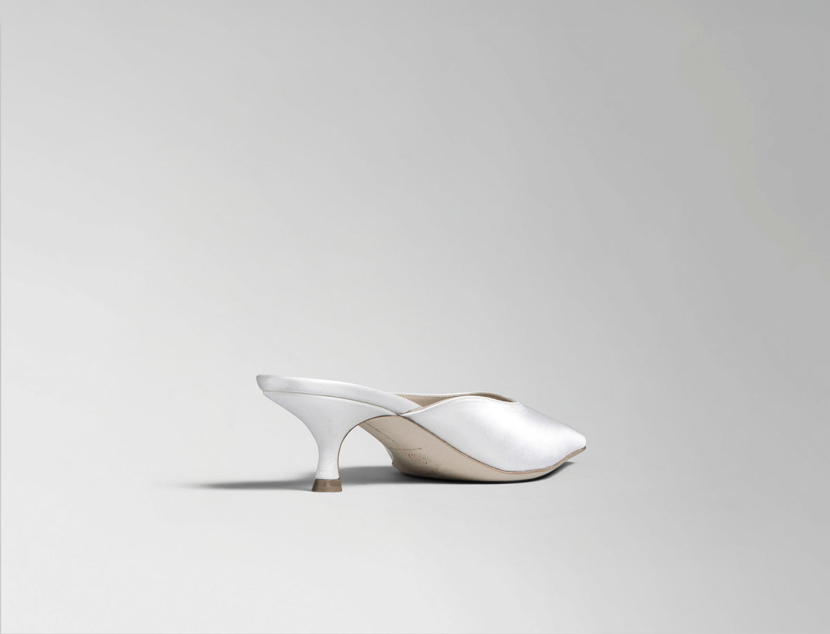 Ivory satin square toe mule with 50 mm kitten heel. Hand crafted in Italy.