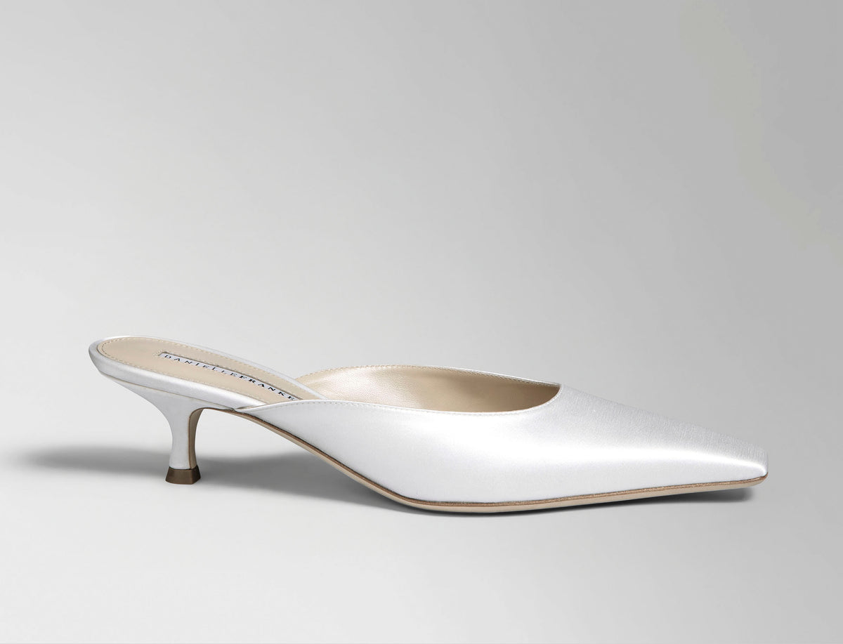 Ivory satin square toe mule with 50 mm kitten heel. Hand crafted in Italy.
