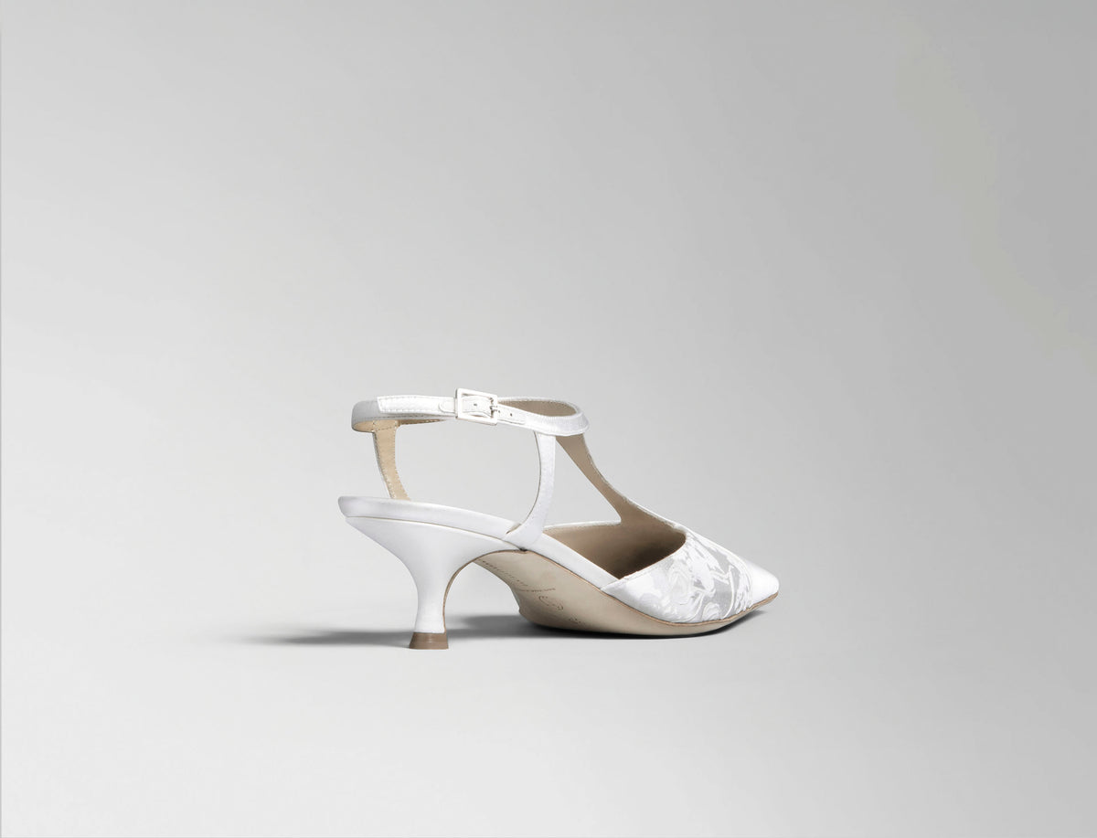 Ivory satin T-strap pump with square toe and pigment printed and hand painted detail. 50 mm kitten heel. Hand crafted in Italy.