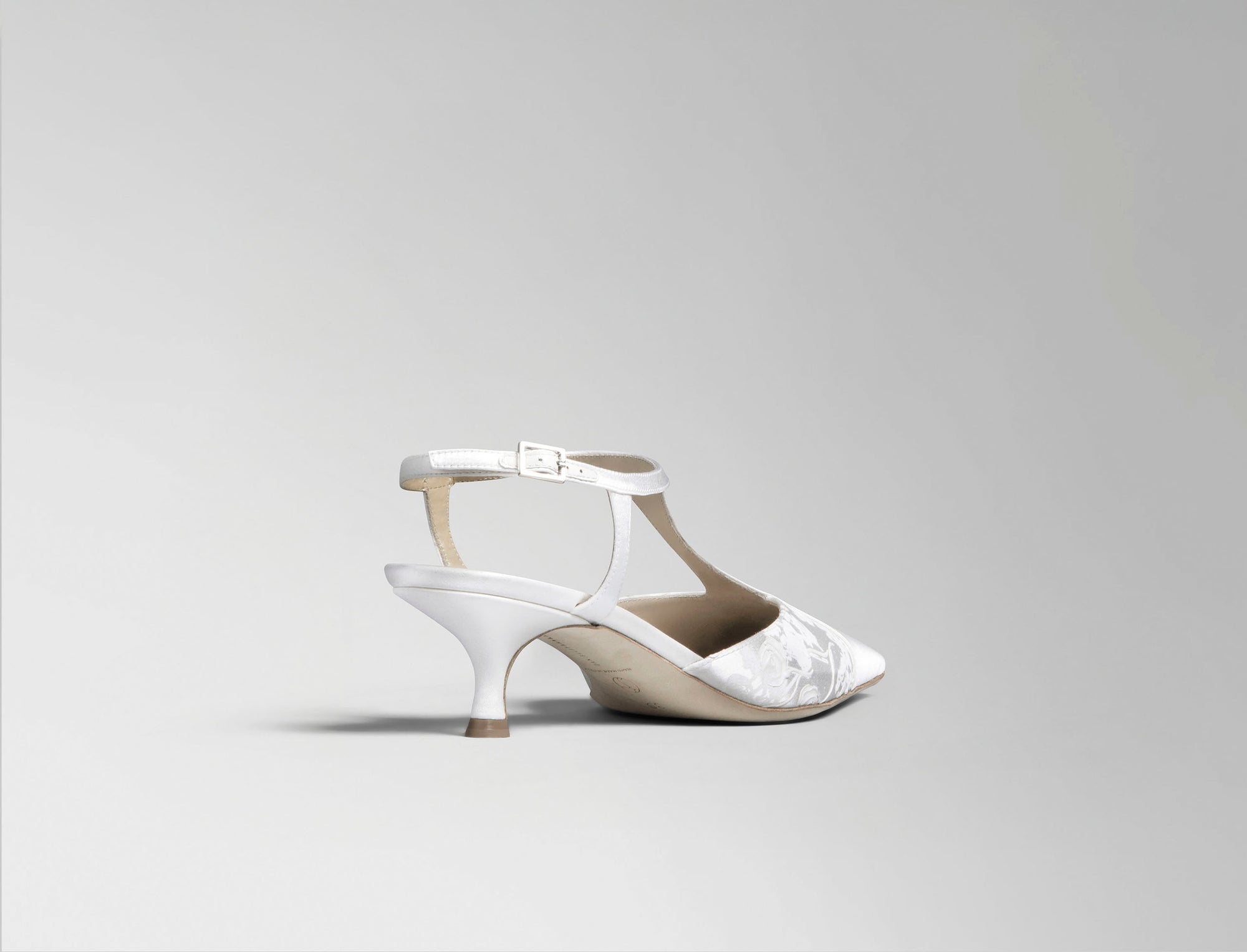 Ivory satin T-strap pump with square toe and pigment printed and hand painted detail. 50 mm kitten heel. Hand crafted in Italy.