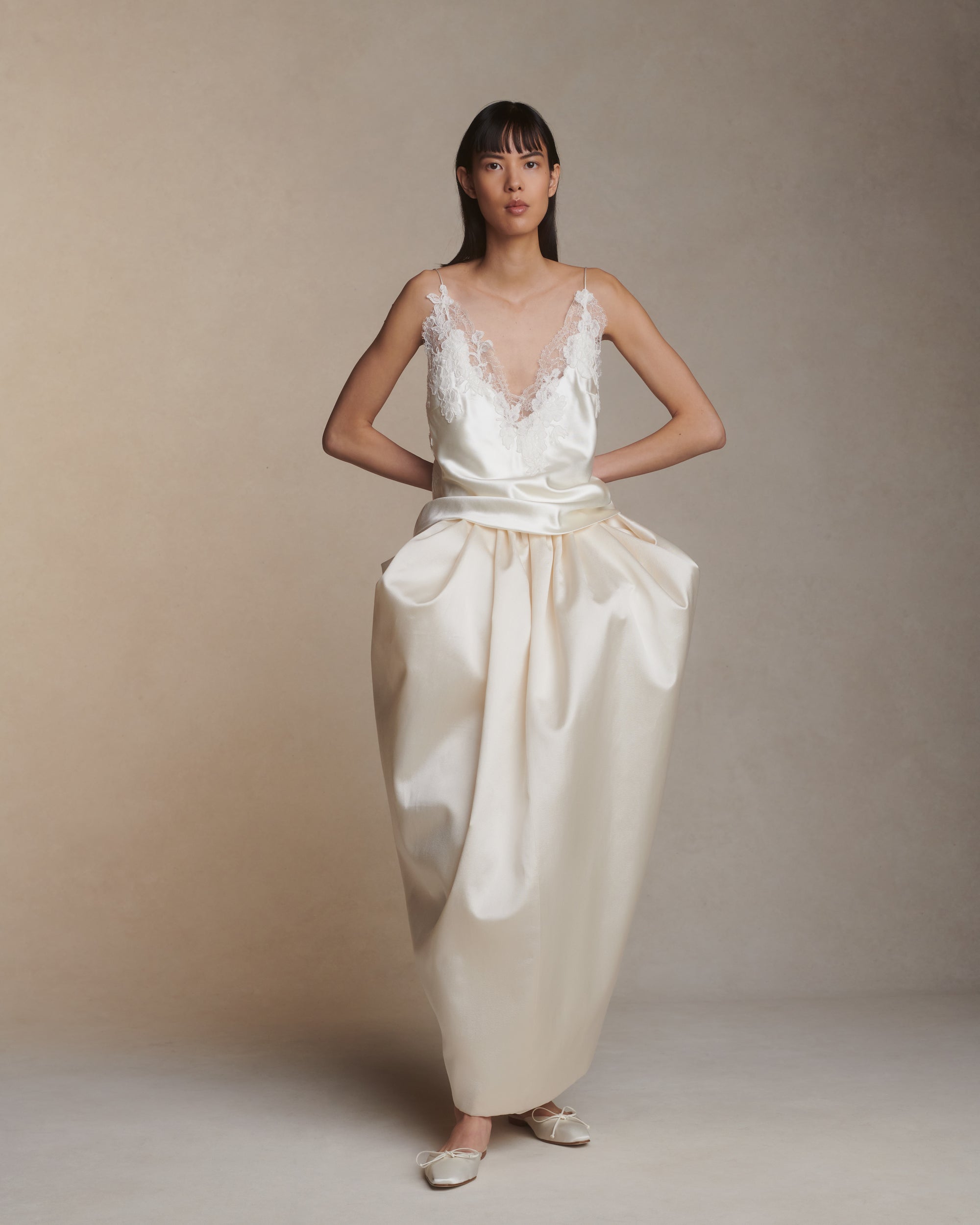 Bias cut silk wool camisole top with spaghetti straps and low back. Hand cut corded and chantilly lace adorn the hem. Slip on styling.Styled with Tilly skirt