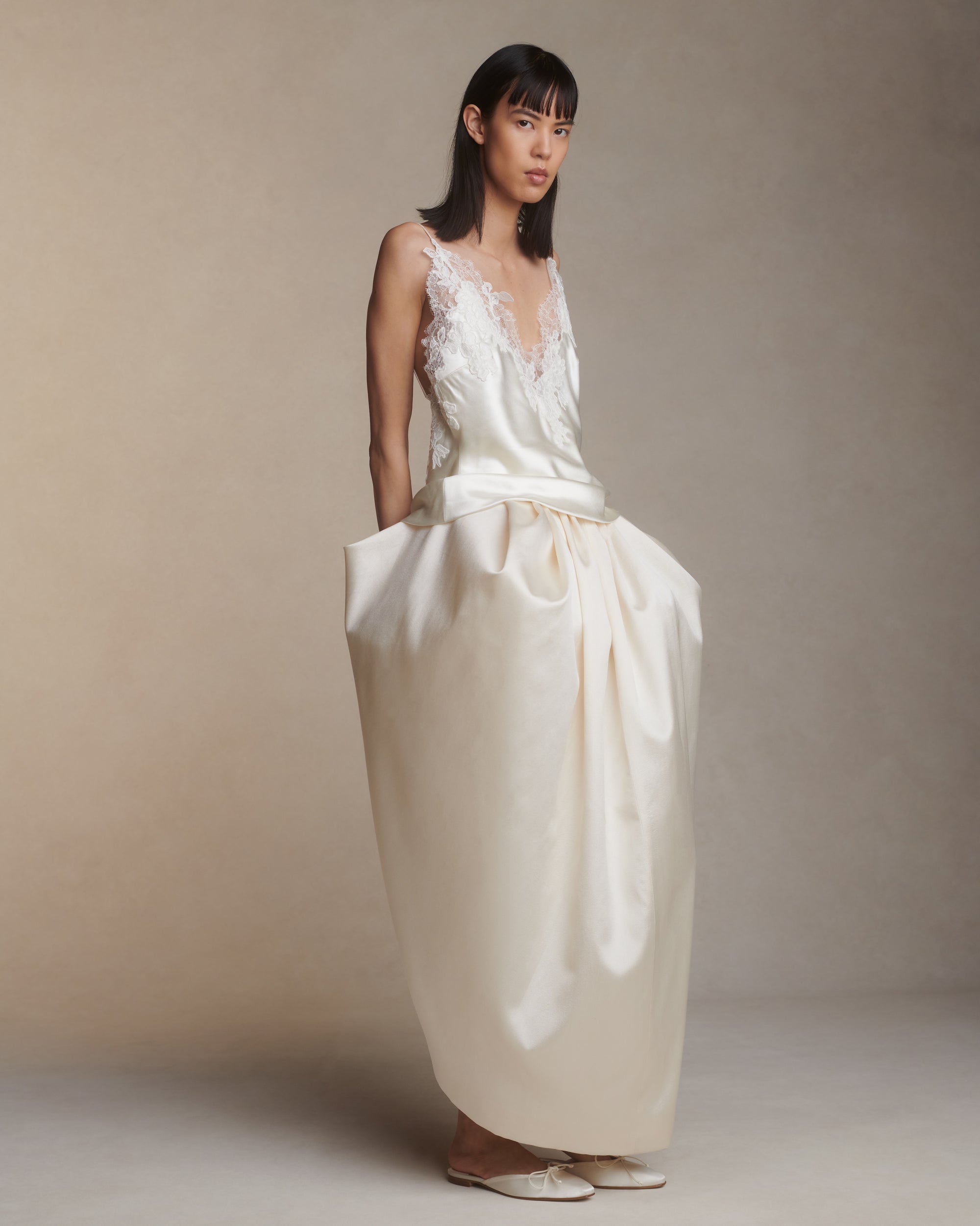 Bias cut silk wool camisole top with spaghetti straps and low back. Hand cut corded and chantilly lace adorn the hem. Slip on styling.Styled with Tilly skirt