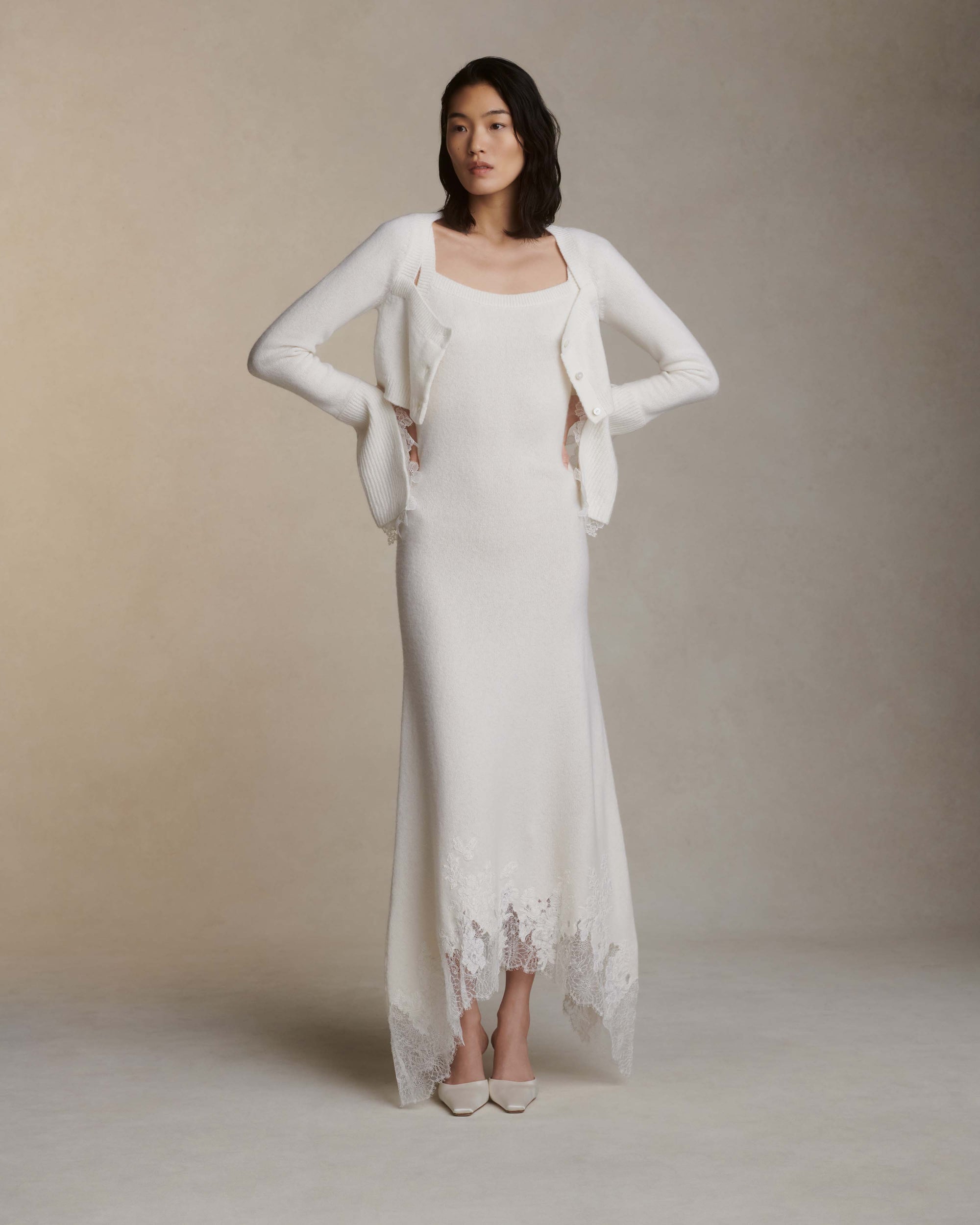 Silk cashmere cropped cardigan. Square neck, Chantilly handkerchief detail at cuff. Three button close.Fits true to size: 0/2 = XS2/4 = S6/8 = M8/10 = L10/12 = XL Styled with Cheryl dress