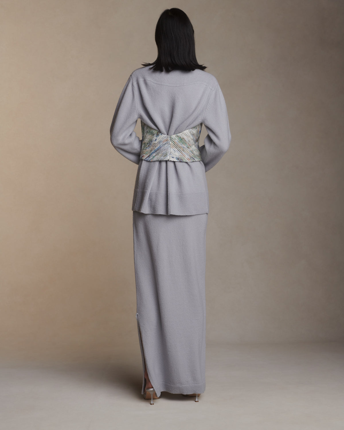 Strapless hand tucked silk taffeta bodice with piqued bust and scooped back. Angled micro tucking creates shape through waist. Boned internal bustier with soft cups, internal grosgrain waist belt and invisible side zip closure.