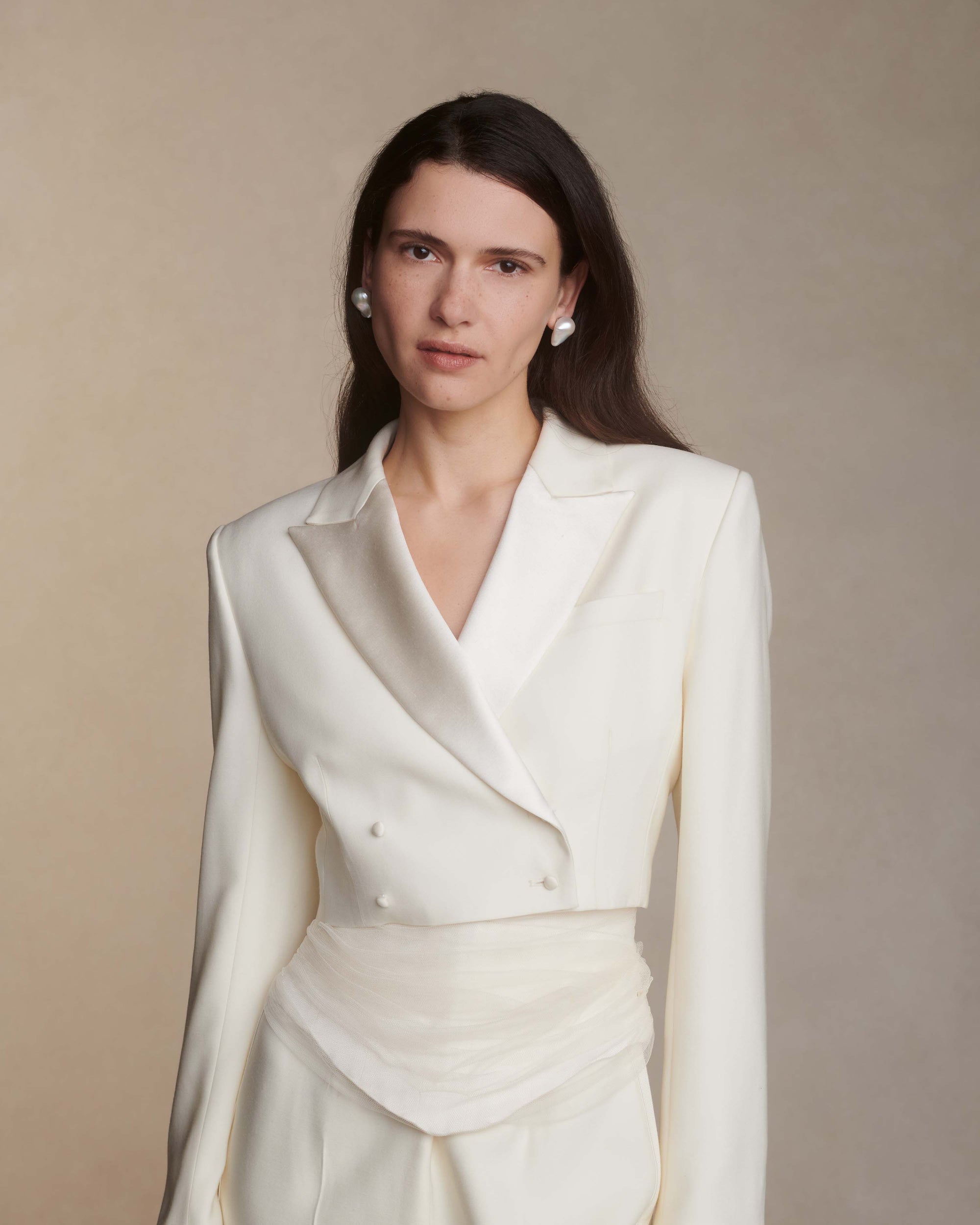 Silk Wool cropped blazer with double breasted covered button closure.Styled with Jack pant &amp; Milo bustier