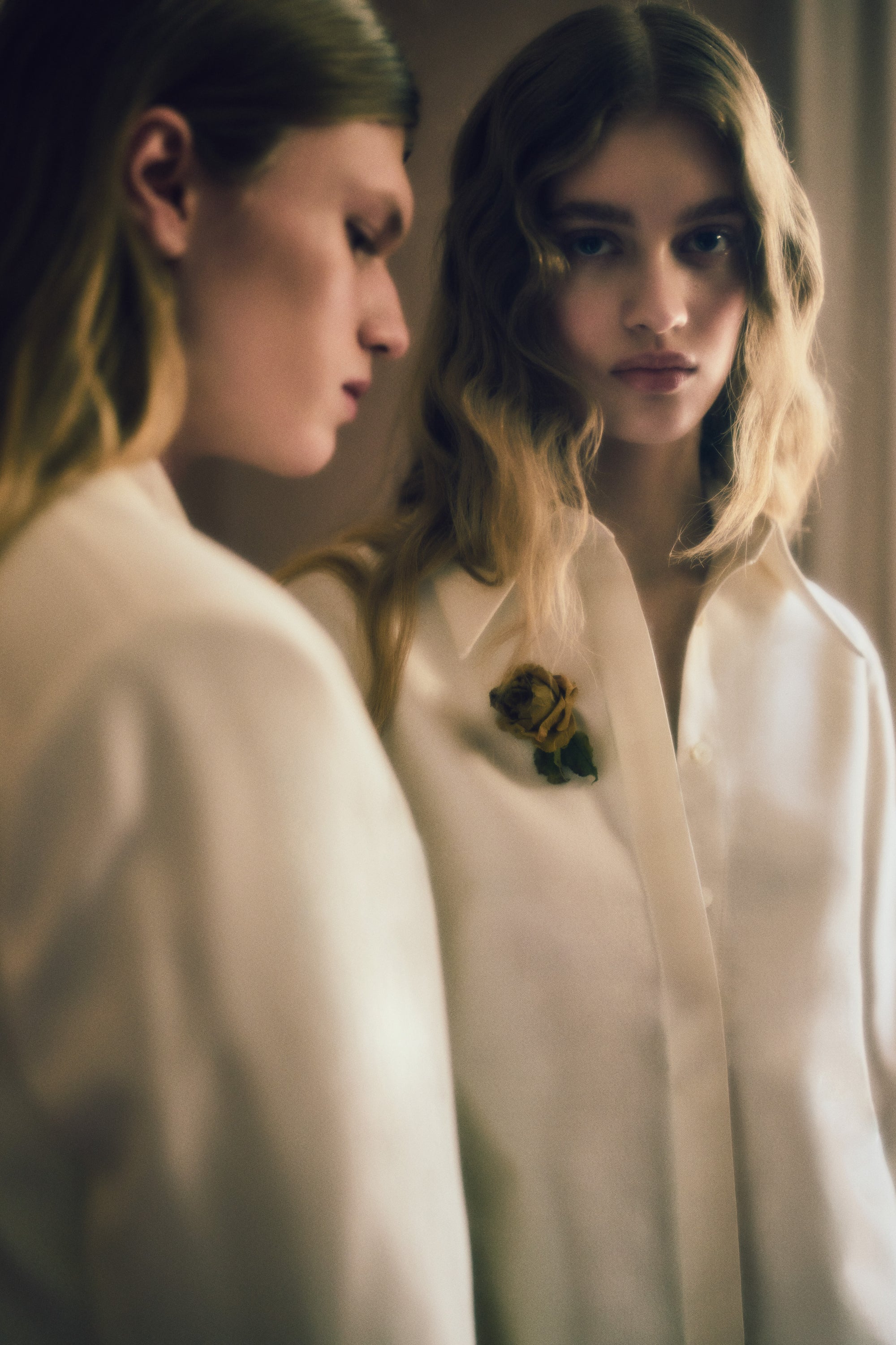 Matte silk wool double breasted jacket with luminous silk wool peaked lapel. Two welt pockets at front and double vented back. Ivory shell buttons at center front and sleeve opening.