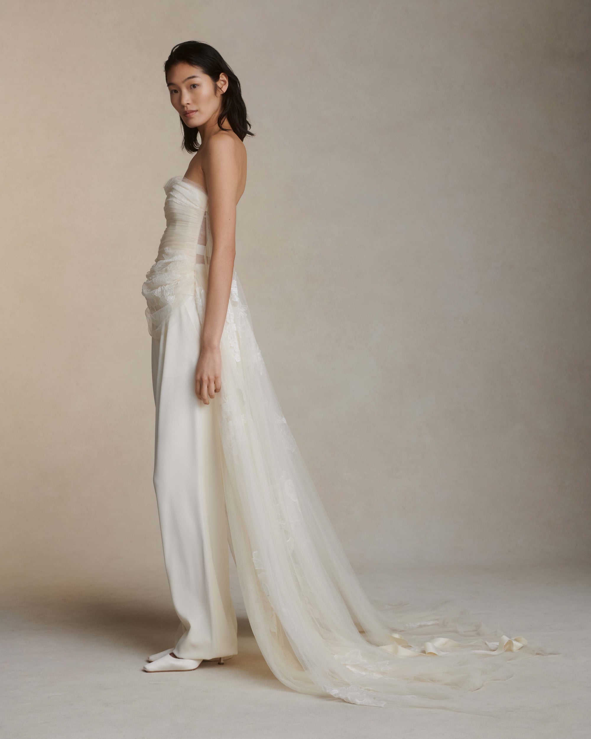 Sits at natural waist, tailored cady pant with ivory grosgrain tuxedo detail at side seams. Menswear inspired pleated front with side pockets. Hook &amp; eye zip with snap fastener and zip to close.Styled with Mia &amp; Maude top