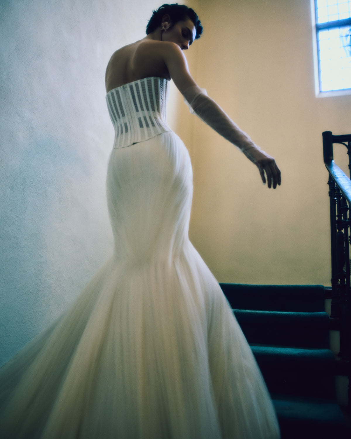 Sunburst pleated and draped soft tulle skirt with bubbled hem. Center back zip.Styled with Milo bustier