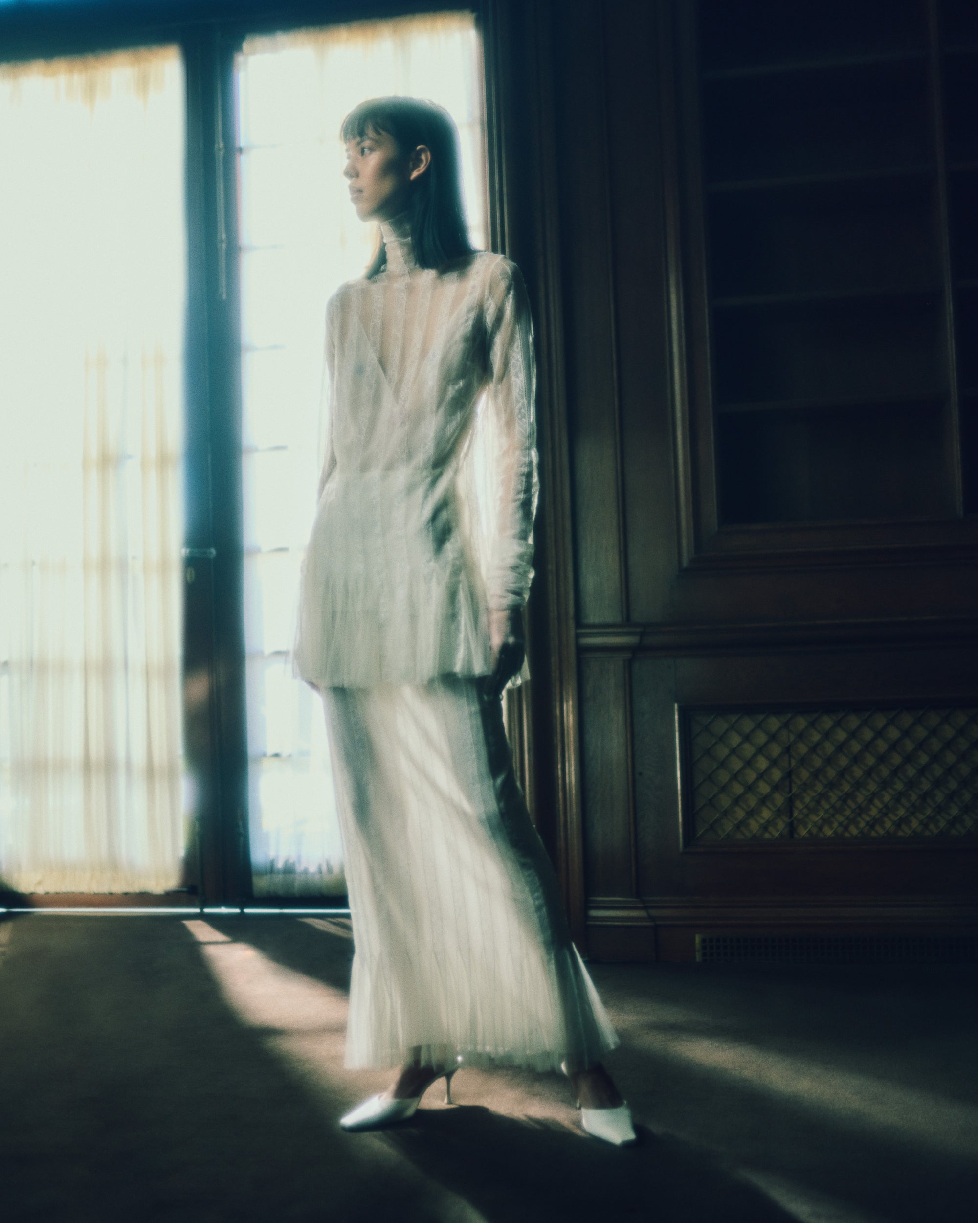 Picot lace column skirt with hand appliqued floral chantilly lace stripes and soft tulle godets at hem. Nude slip lining, invisible side zip closure.