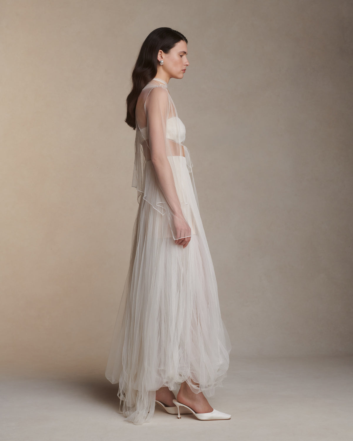 Picot tulle ribbon skirt with internal mini skirt foundation. Vertically layered tulle ribbons cascade over airy tulle underlay to create a bubble hem. Center back zip closure.Style with Scout Bra 