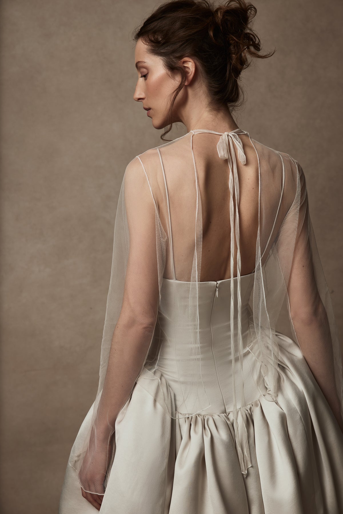 Veiled tulle mock neck topper with open back, split wrist, and delicate single tie at neck to close
