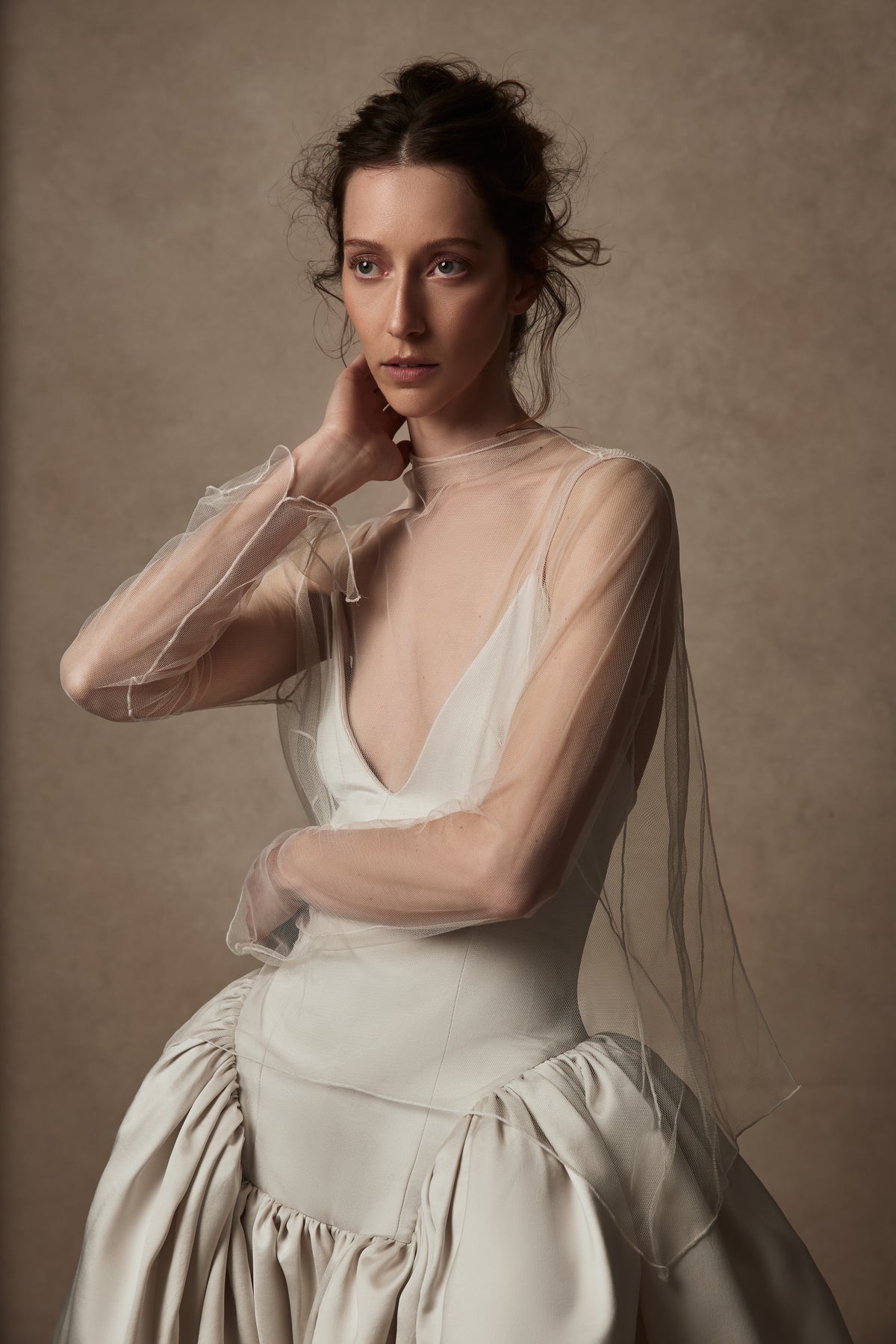 Veiled tulle mock neck topper with open back, split wrist, and delicate single tie at neck to close