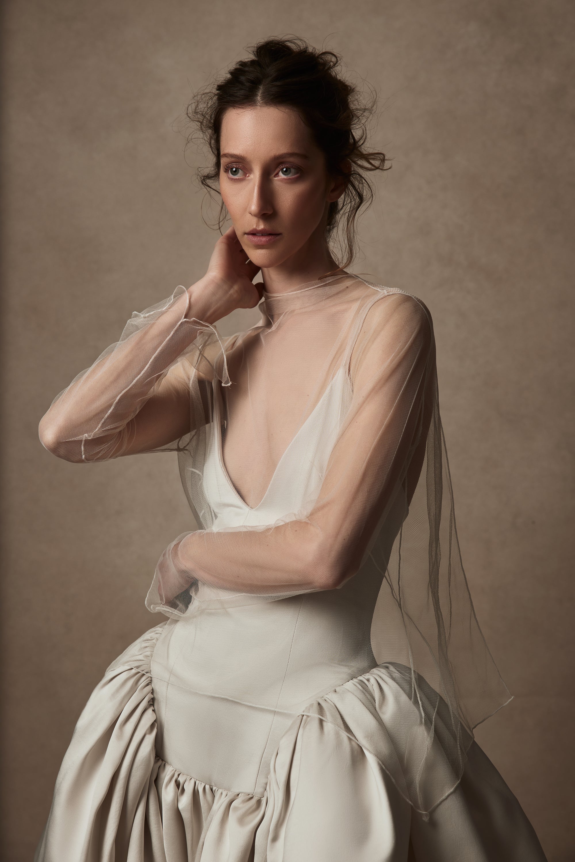 Veiled tulle mock neck topper with open back, split wrist, and delicate single tie at neck to close