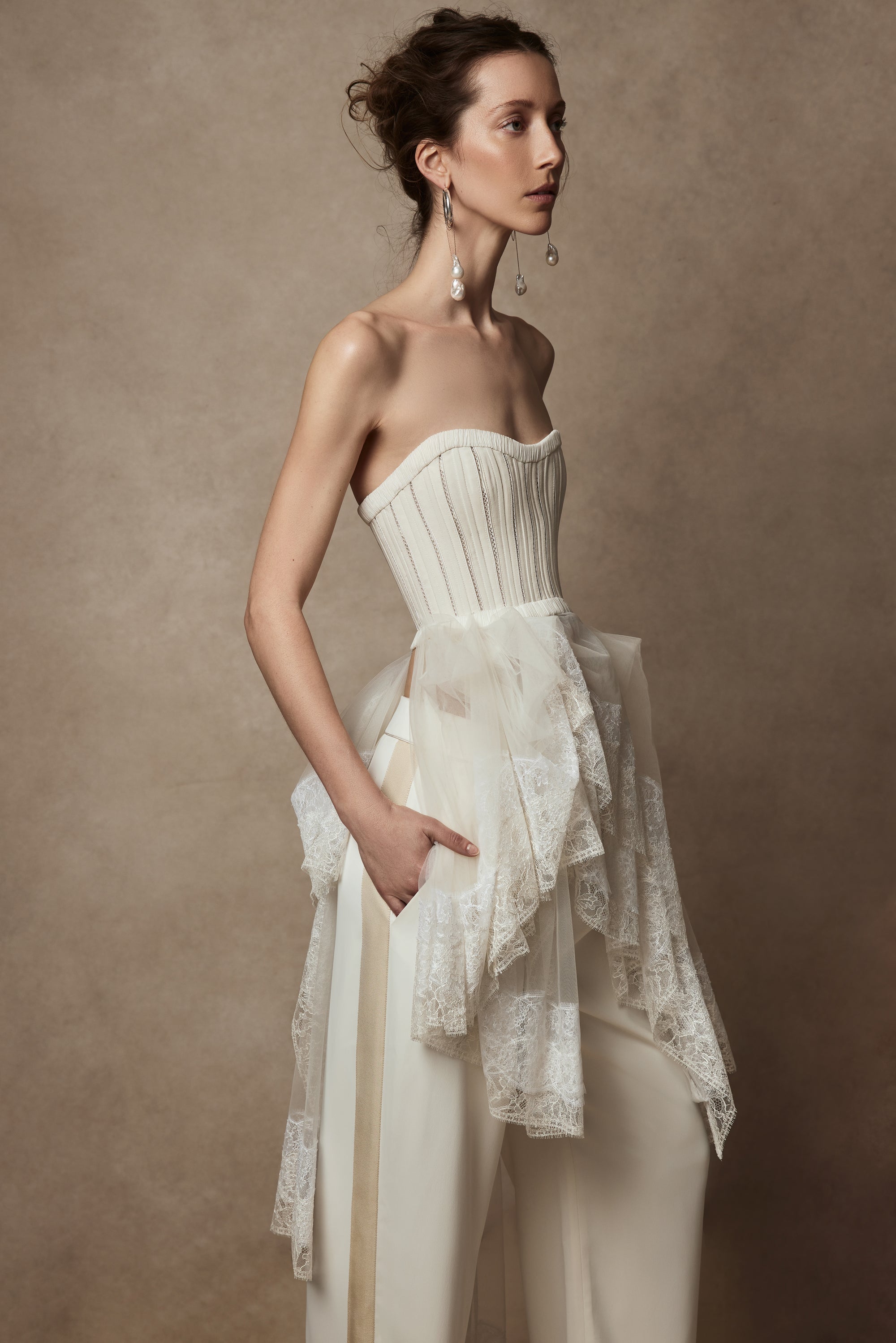 Pleated georgette trim bustier with contrasting dual optic and ivory lace scarf detail with button offoption. Center back hook and eye closure.