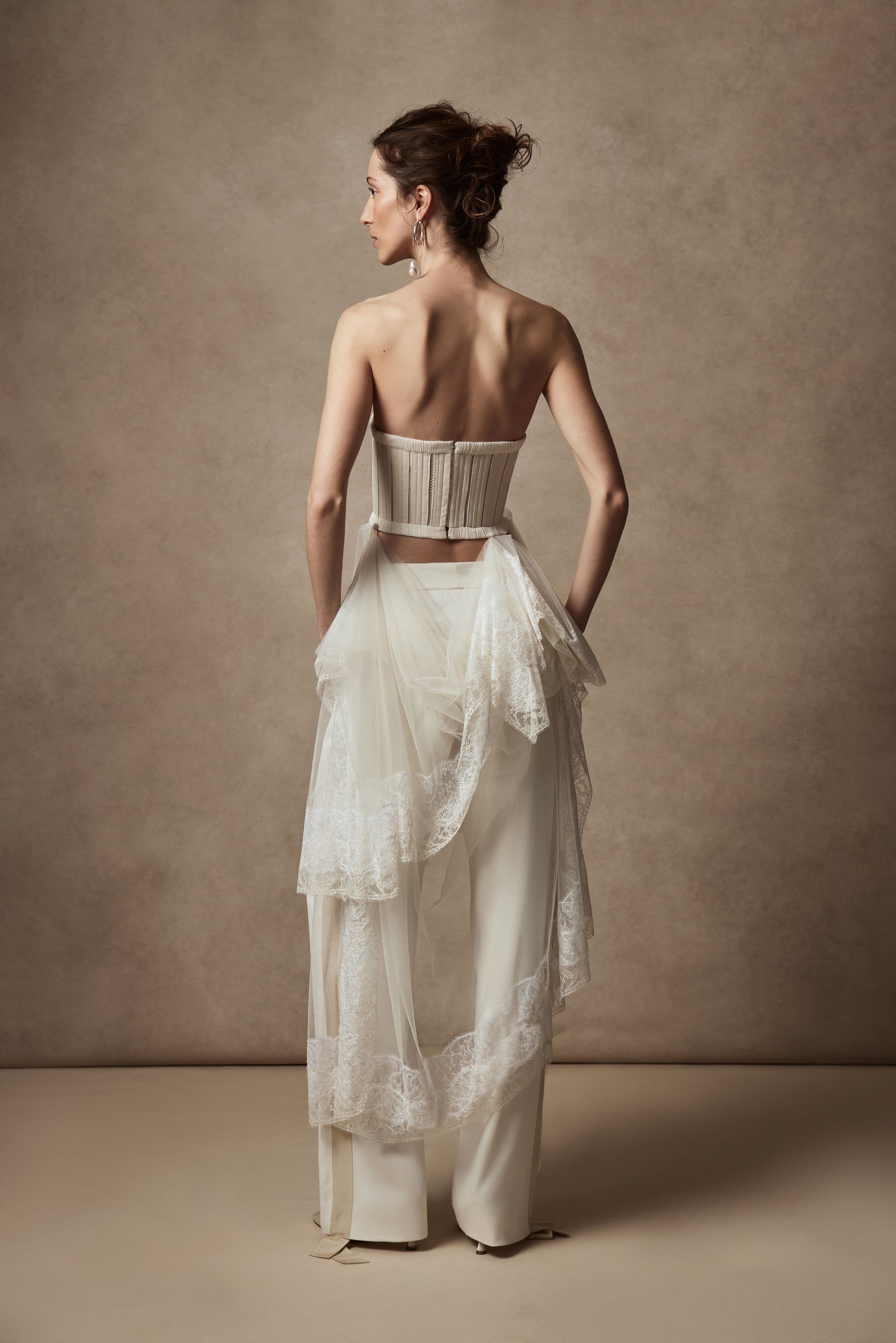 Pleated georgette trim bustier with contrasting dual optic and ivory lace scarf detail with button offoption. Center back hook and eye closure.