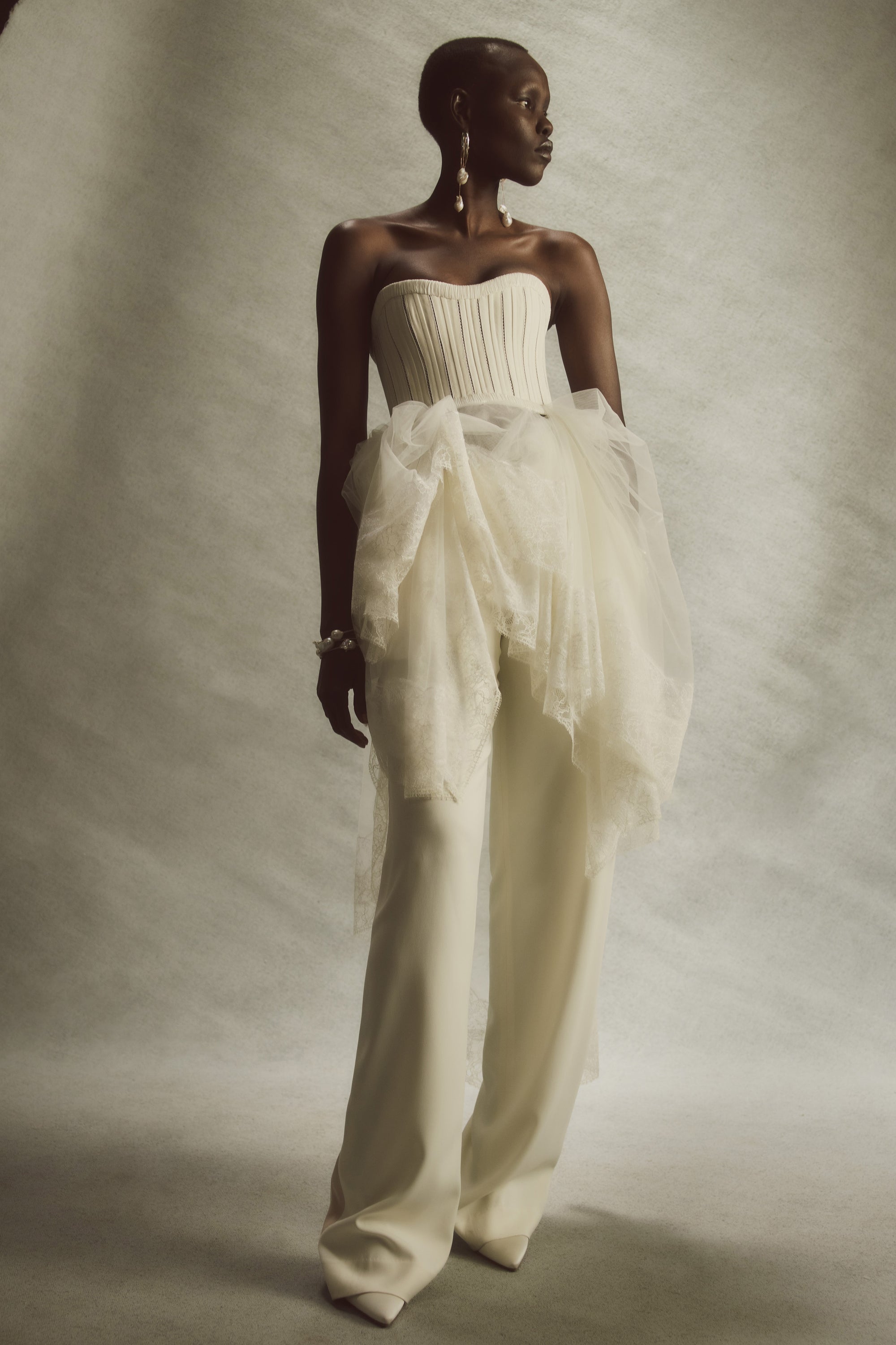 Sits at natural waist, tailored cady pant with ivory grosgrain tuxedo detail at side seams. Menswear inspired pleated front with side pockets. Hook &amp; eye zip with snap fastener and zip to close.Styled with Mia &amp; Maude top