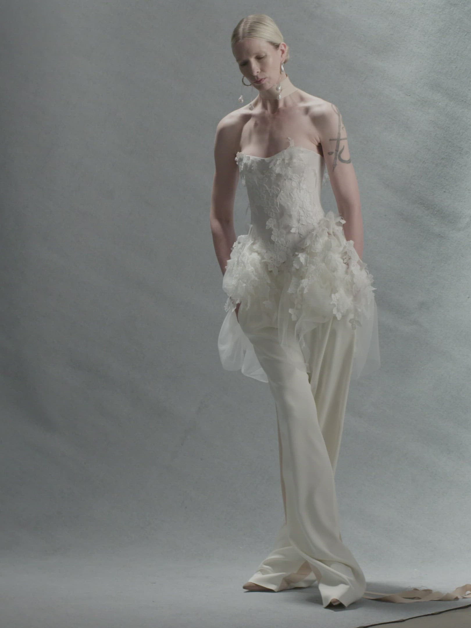 Satin twill bound, chantilly and corded lace applique bustier with draped tulle accent at hips. Back zip with hook and eye closure for security and structure.﻿